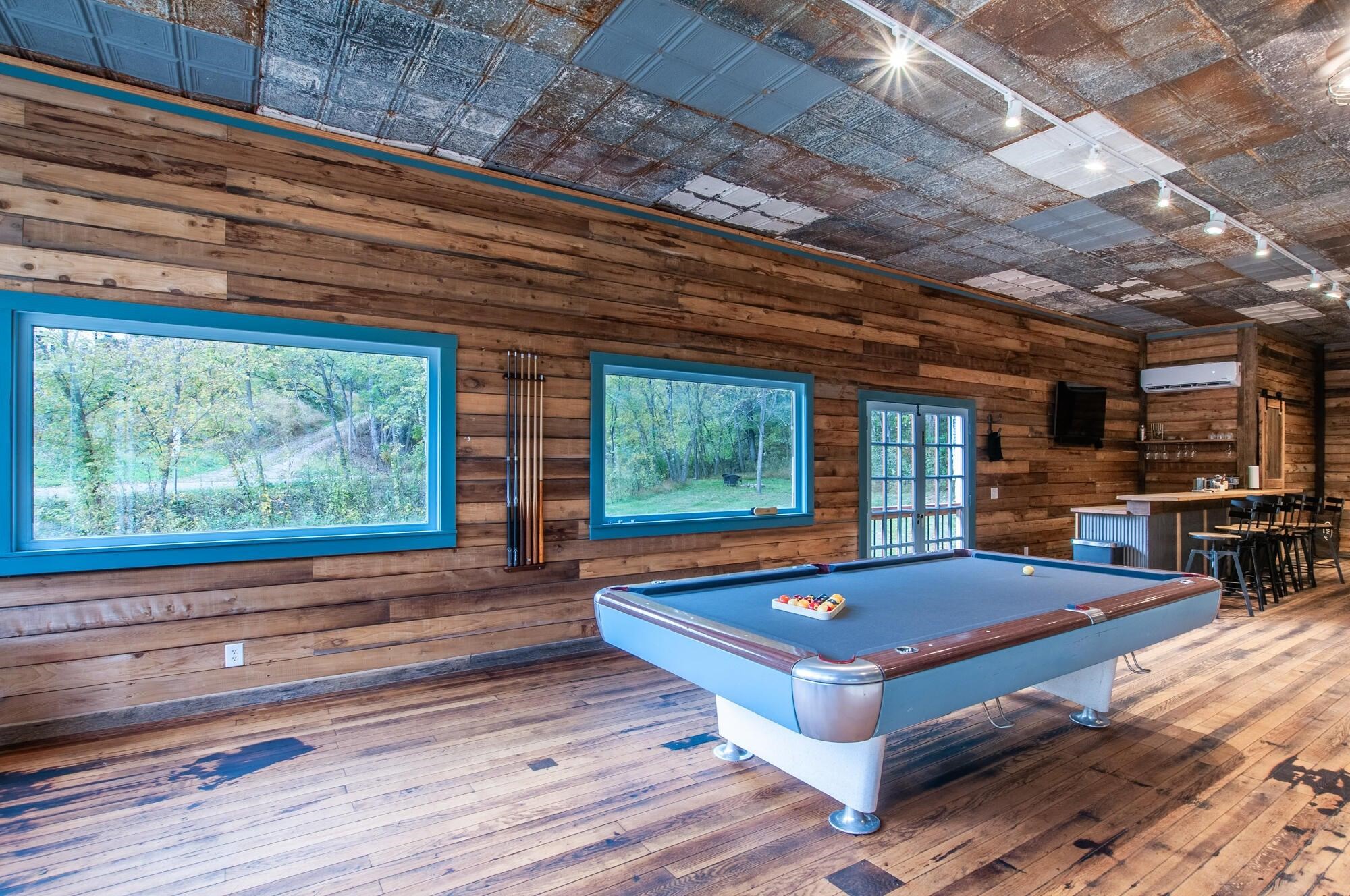 Play a game of billiards on the pool table.
