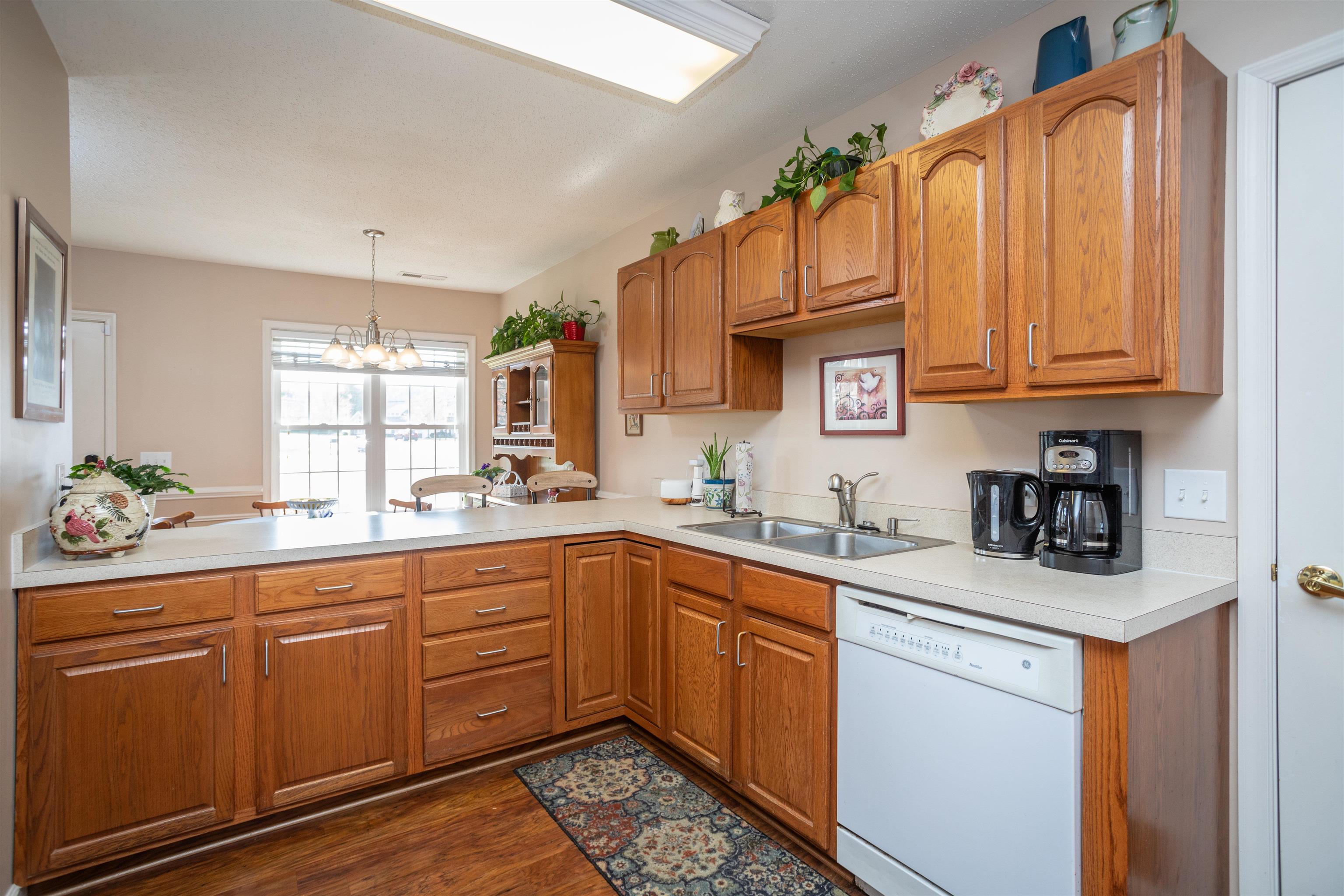 This well designed kitchen features lots of counter and cabinet space plus a good size pantry