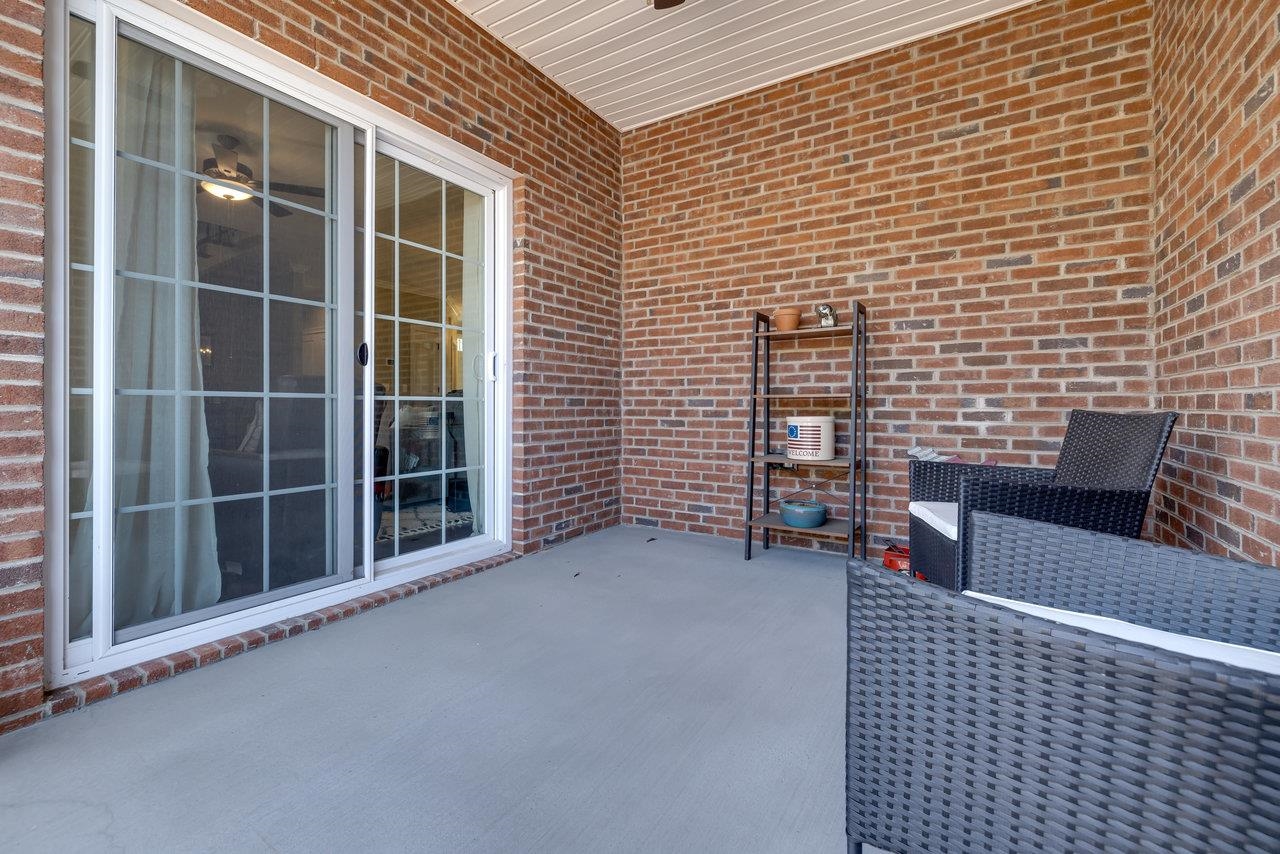 This inviting outdoor space is conveniently located off the great room on the main level of the home.