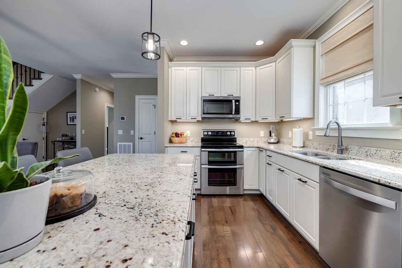 The kitchen is highlighted by granite countertops