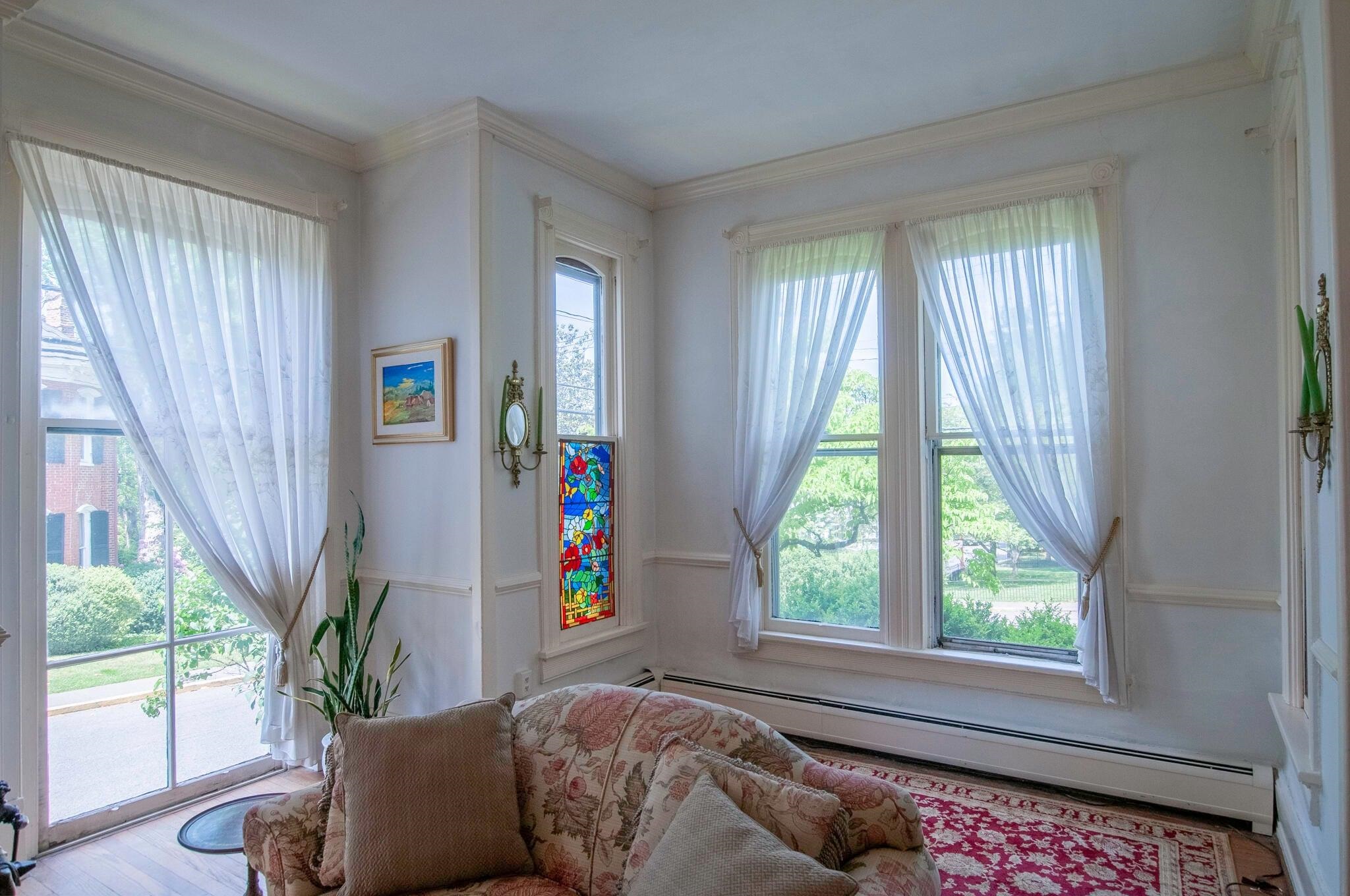 Beautiful windows in the living room look out on Jackson Avenue and White Street.