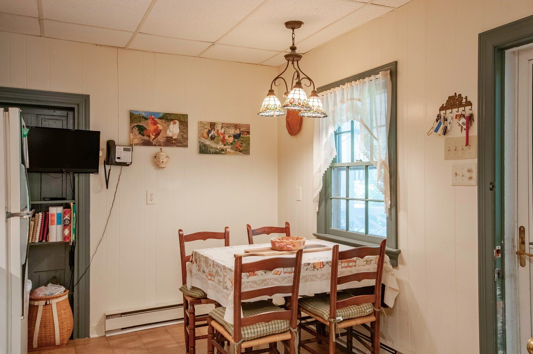 Eat-in kitchen. The door exits to the screen-in porch.