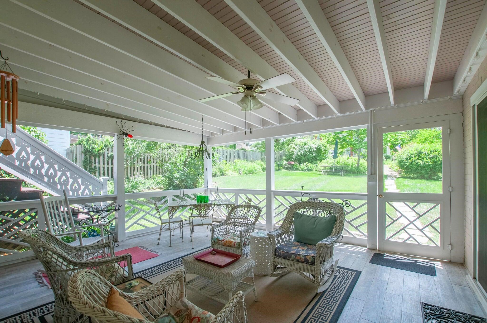 Lovely screened-in porch provides apace for outdoor meals and activities.