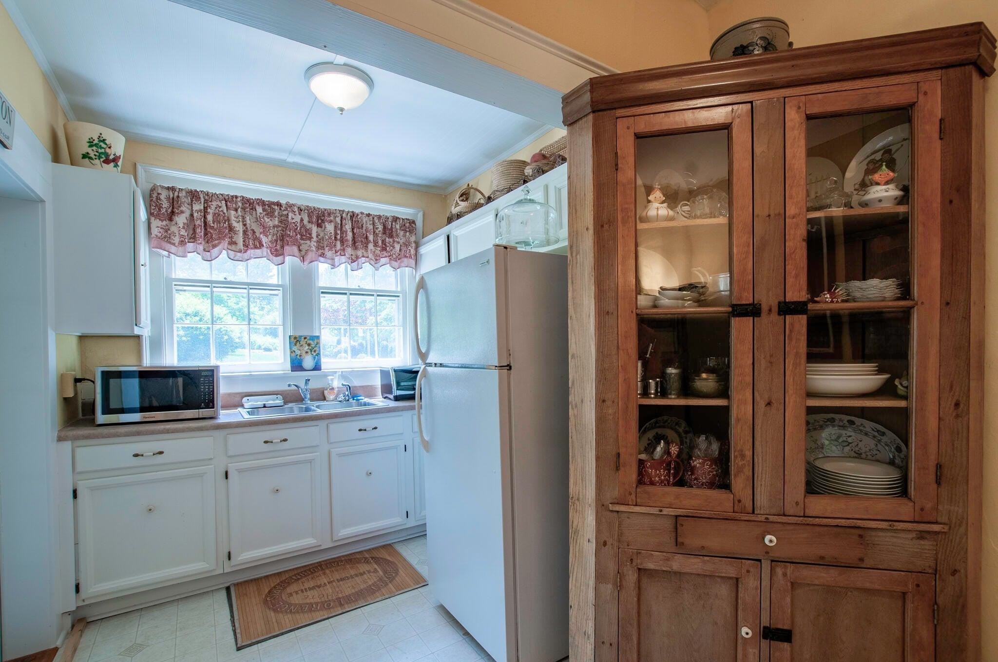 This 2nd first floor kitchen was the centerpiece of an apartment, 402 Jackson Ave. The current resident use it as a wet bar serving their screened porch gatherings.