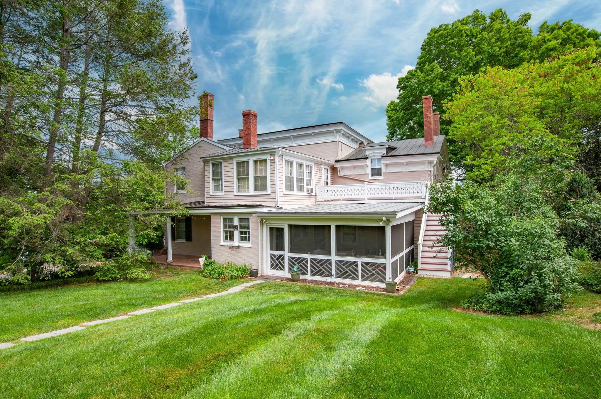 Screened rear porch invites relaxation and out-door entertainment.