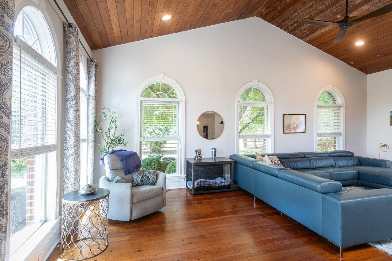 This spacious room features a cathedral ceiling and doors out to the backyard patio