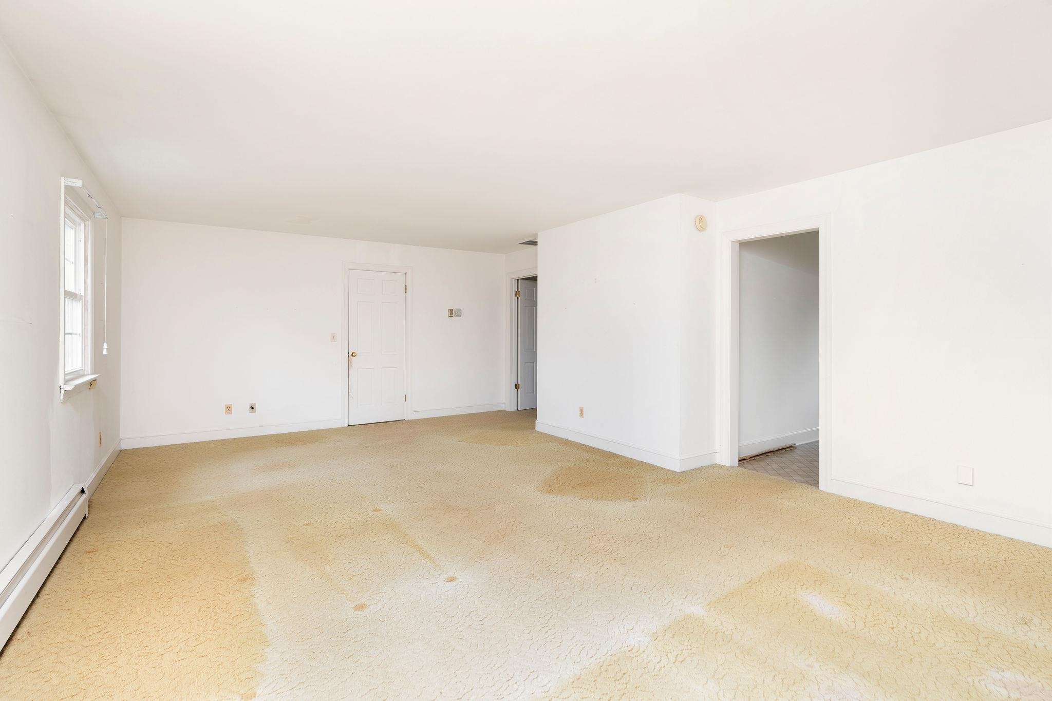 doors to kitchenette and bedroom.