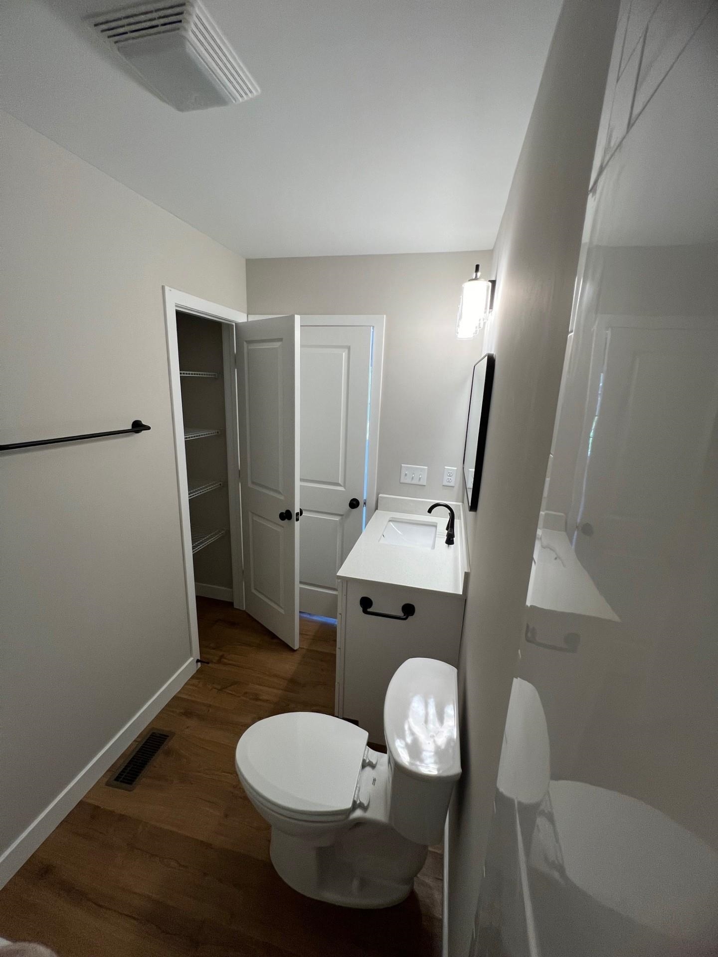 master bathroom showing linen closet inside the room