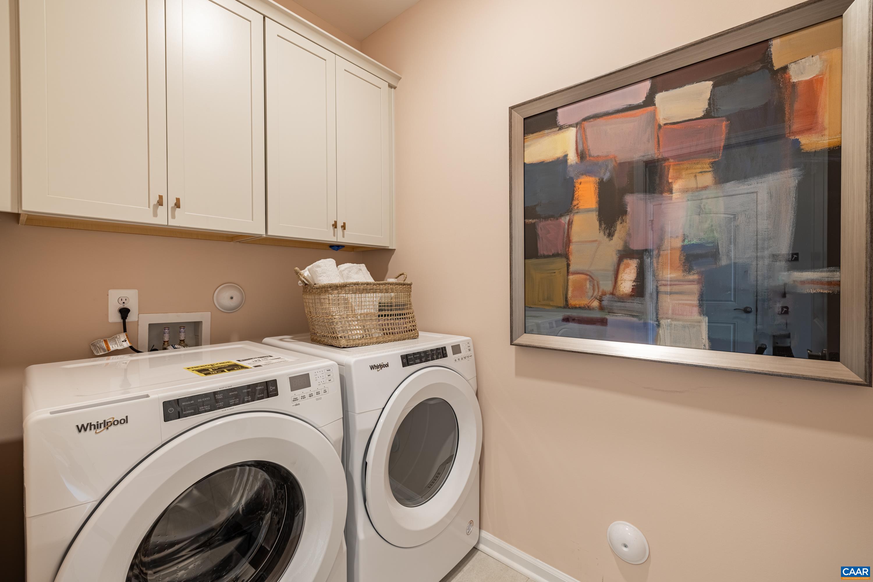 Laundry room situated off owner's entry near kitchen on the first floor.