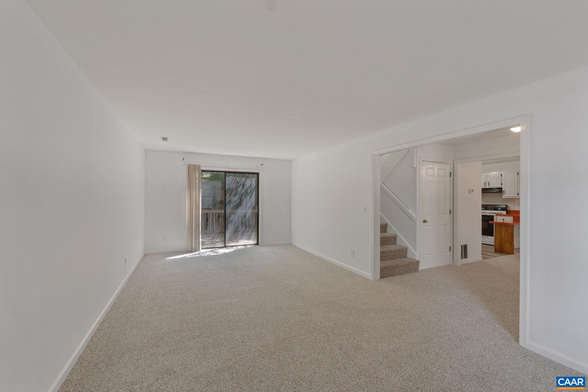 Double Living Room Unit B with sliding door to back deck