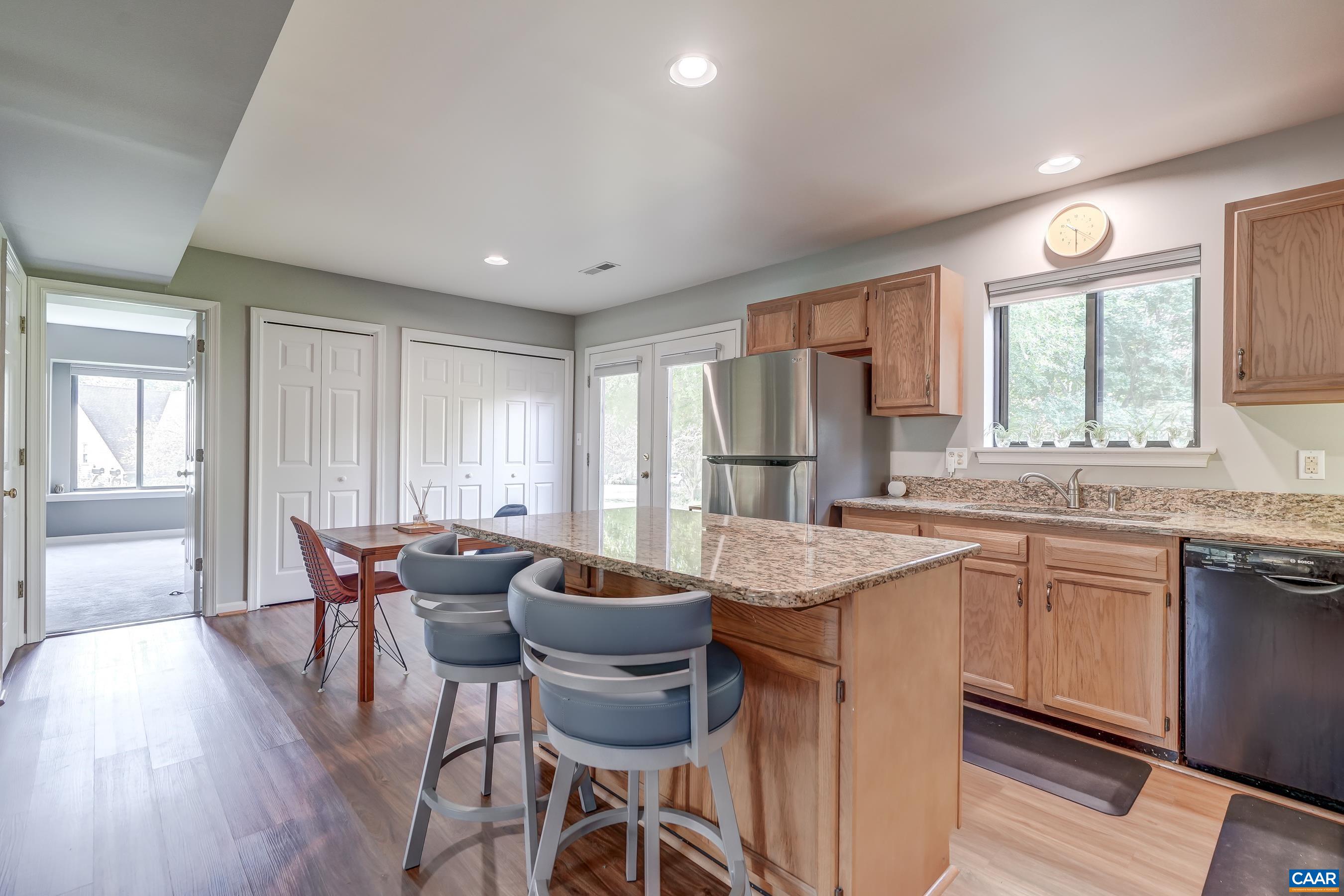 Granite countertops and solid wood cabinets in the kitchen.