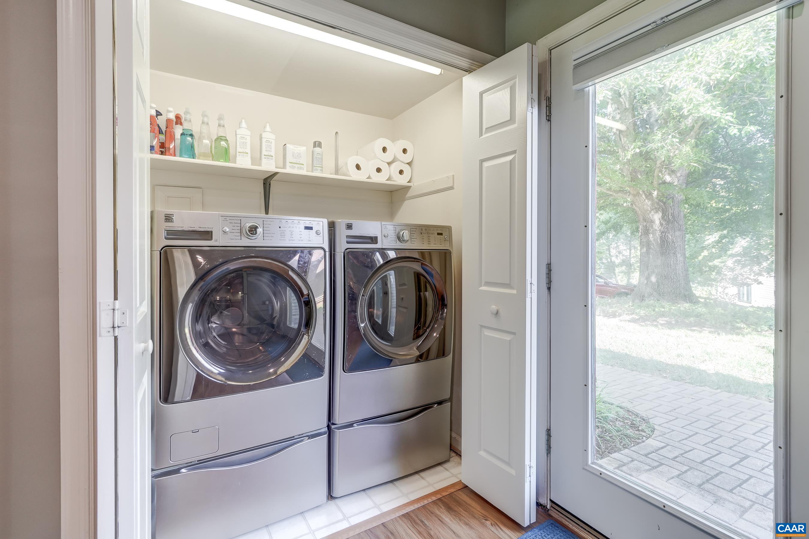 Washer and dryer on main level with pedestals for convenience.