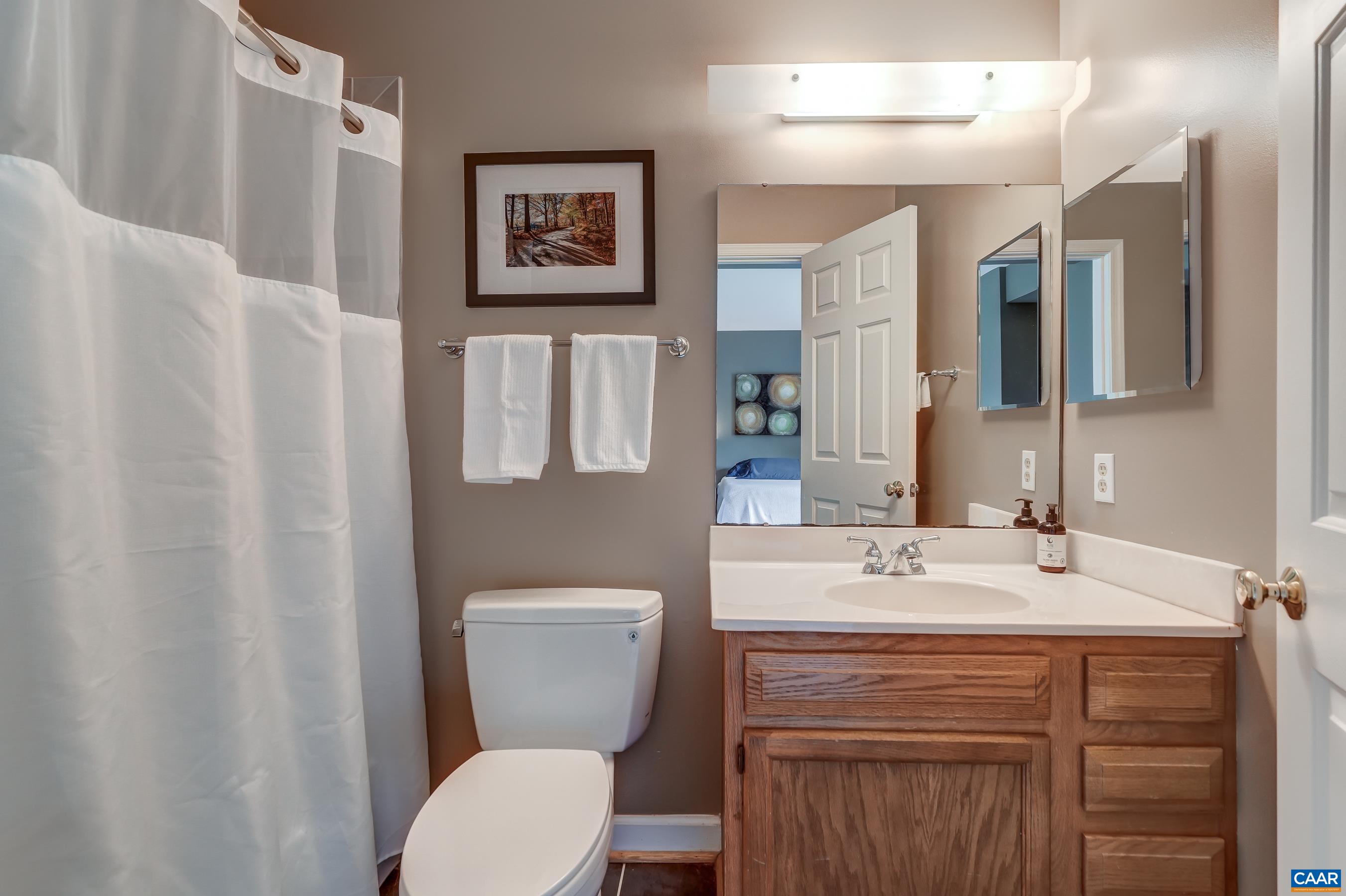 Primary bathroom with tub/shower combo.