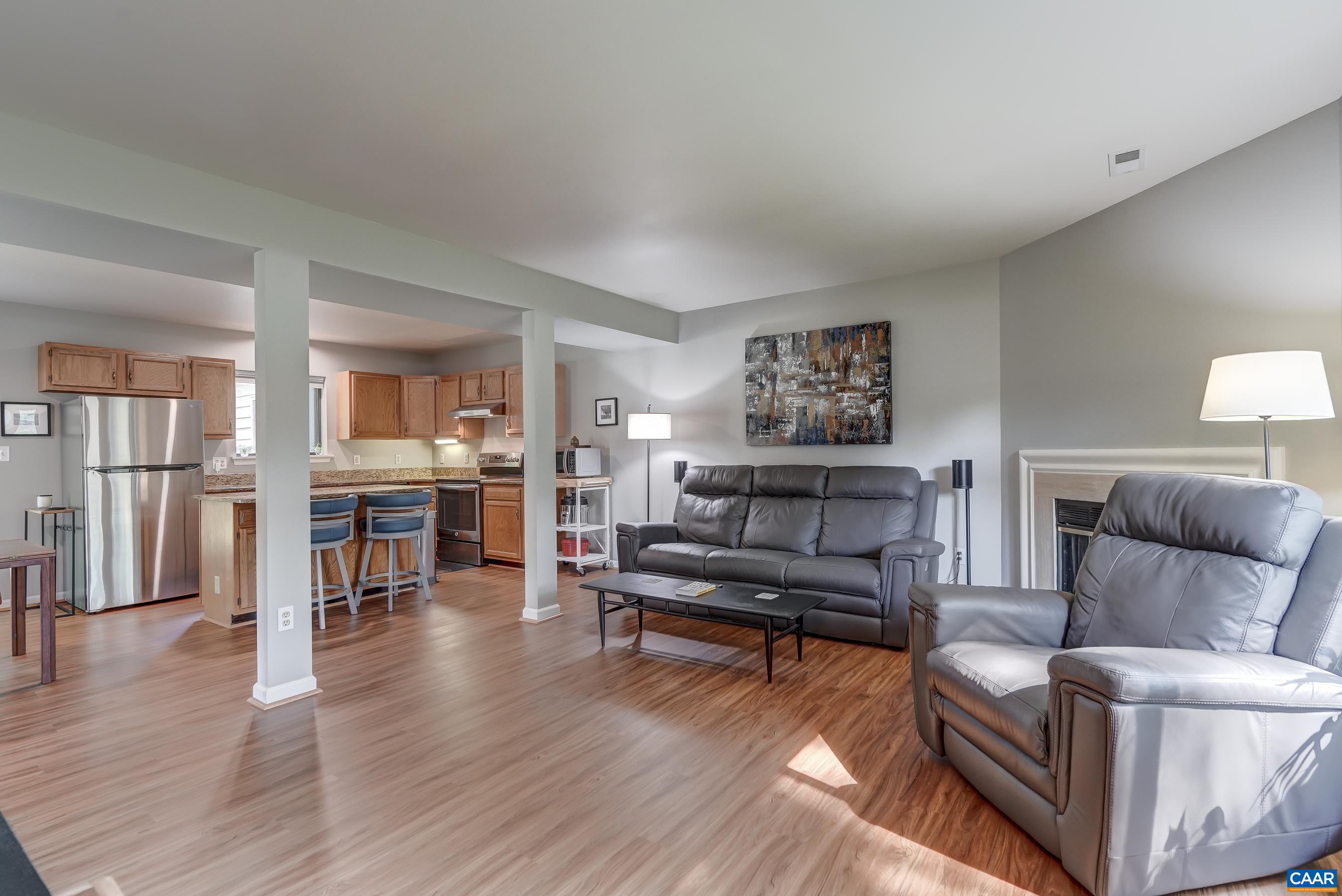 Large living room opens to kitchen and dining rooms for great entertaining options.