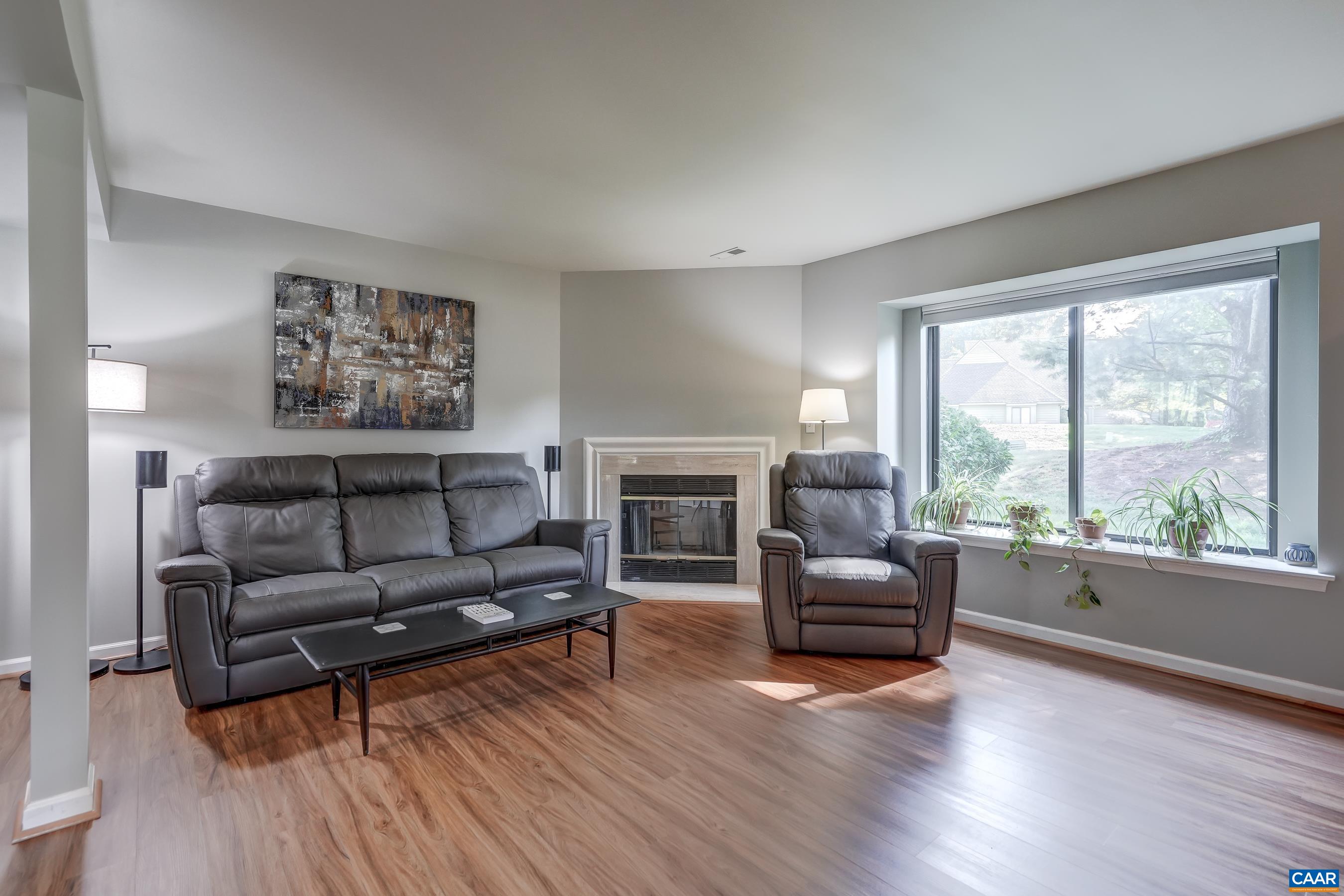 Large bay window fills the living room with natural light.