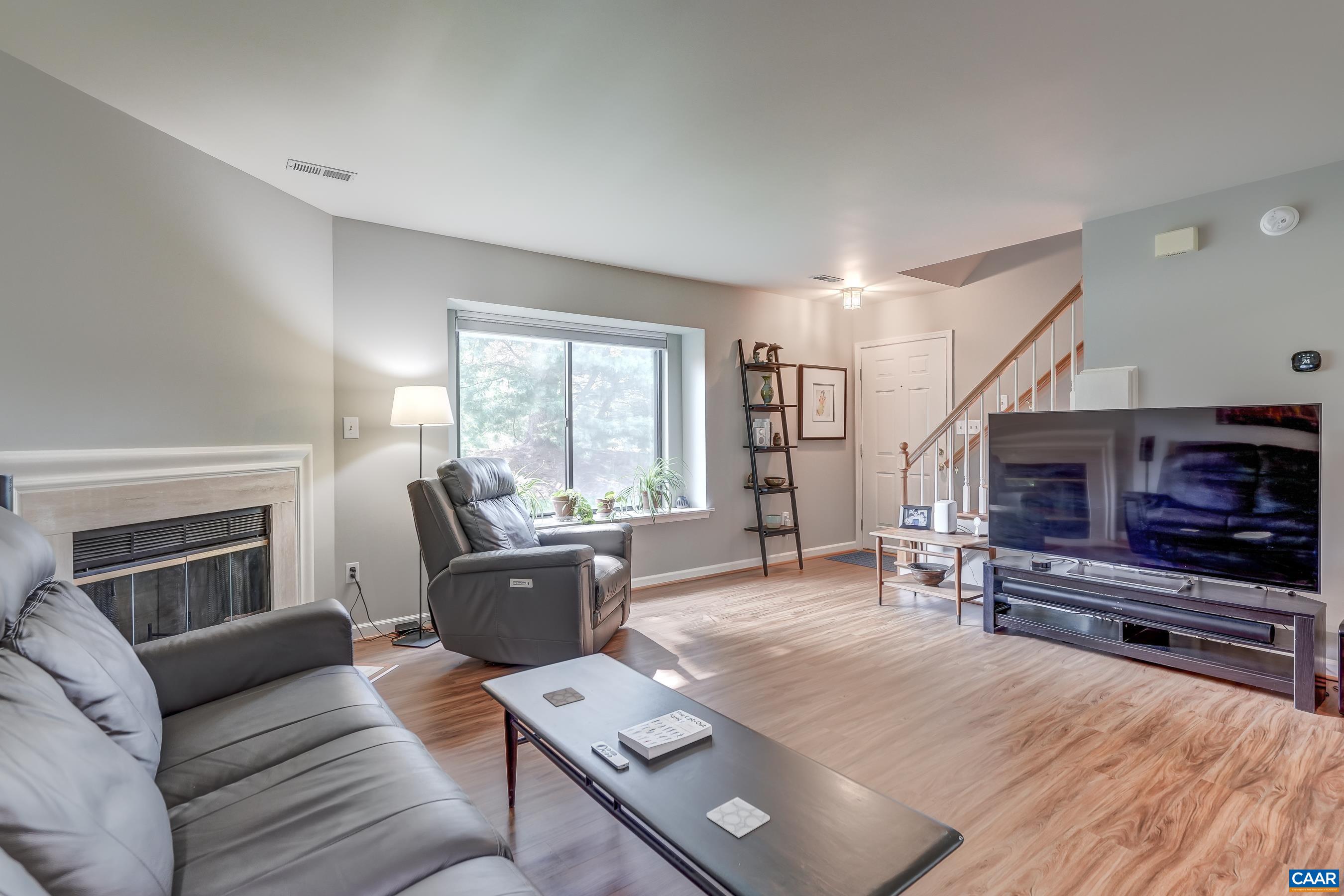 Luxury vinyl plank floors in the living room. dining room, and kitchen.