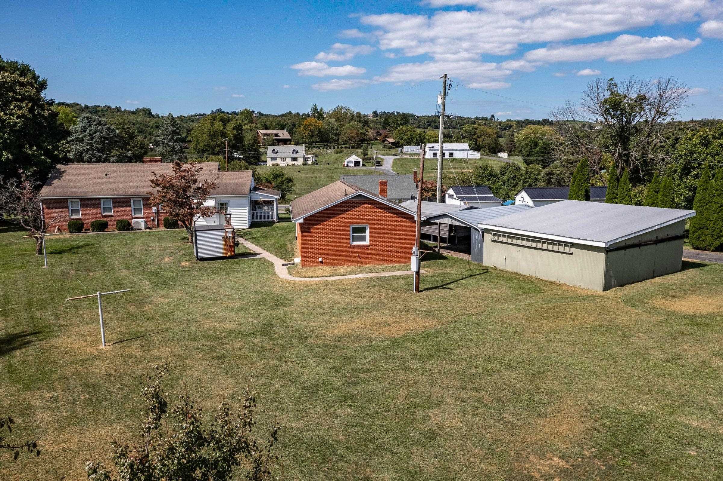 A drones view of the house, garage and carports.