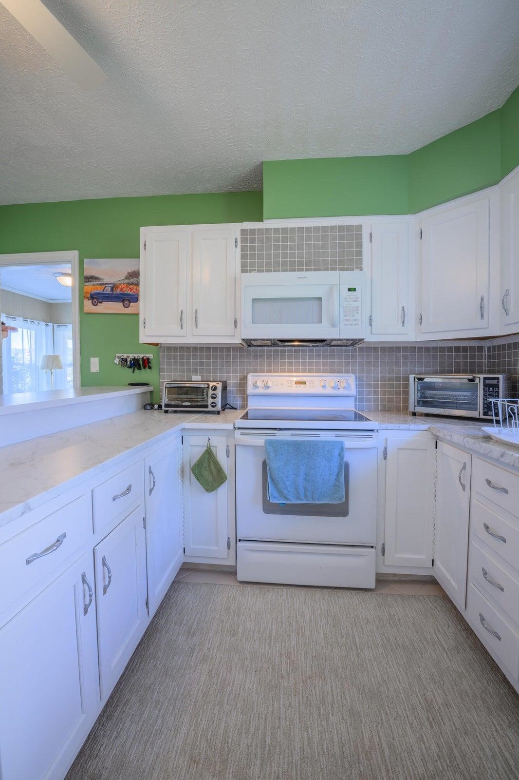 Fresh paint on cabinets and walls.