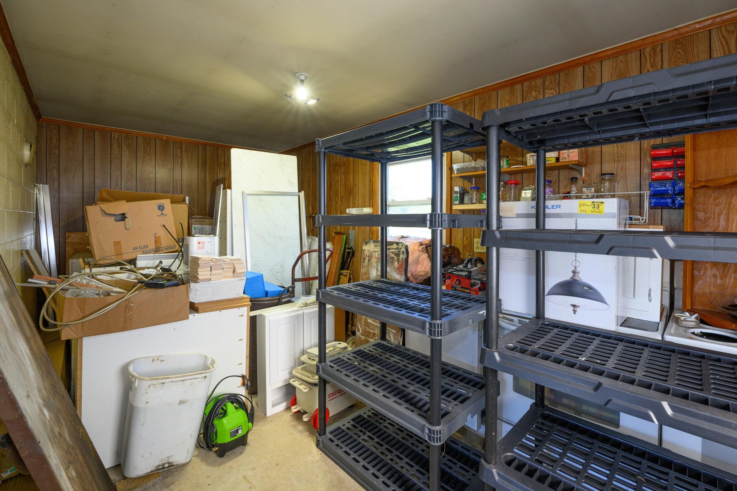 Additional space in the back of the garage, heated, plumbed with its' own separate electric meter and ready to be converted into additional living space.