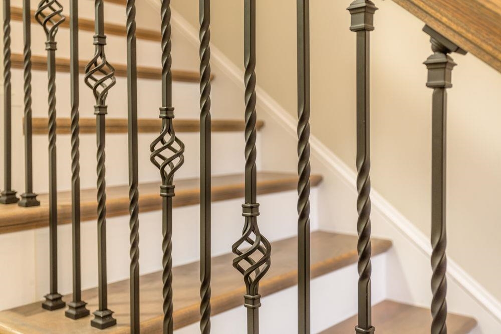 Rod Iron with wood design stairway style.