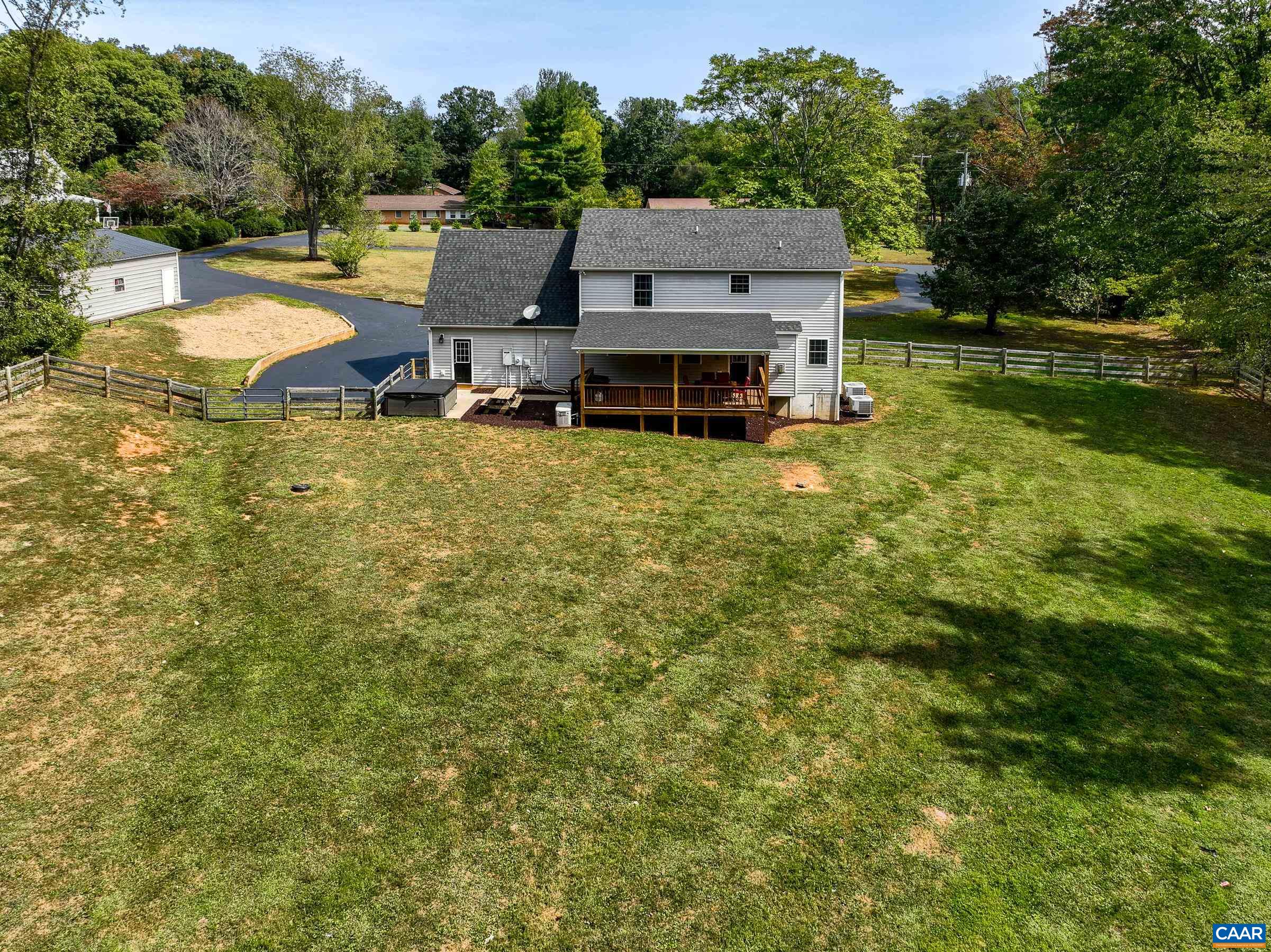 The backyard is enclosed by an attractive 4-board fence, ensuring privacy and security for outdoor activities.