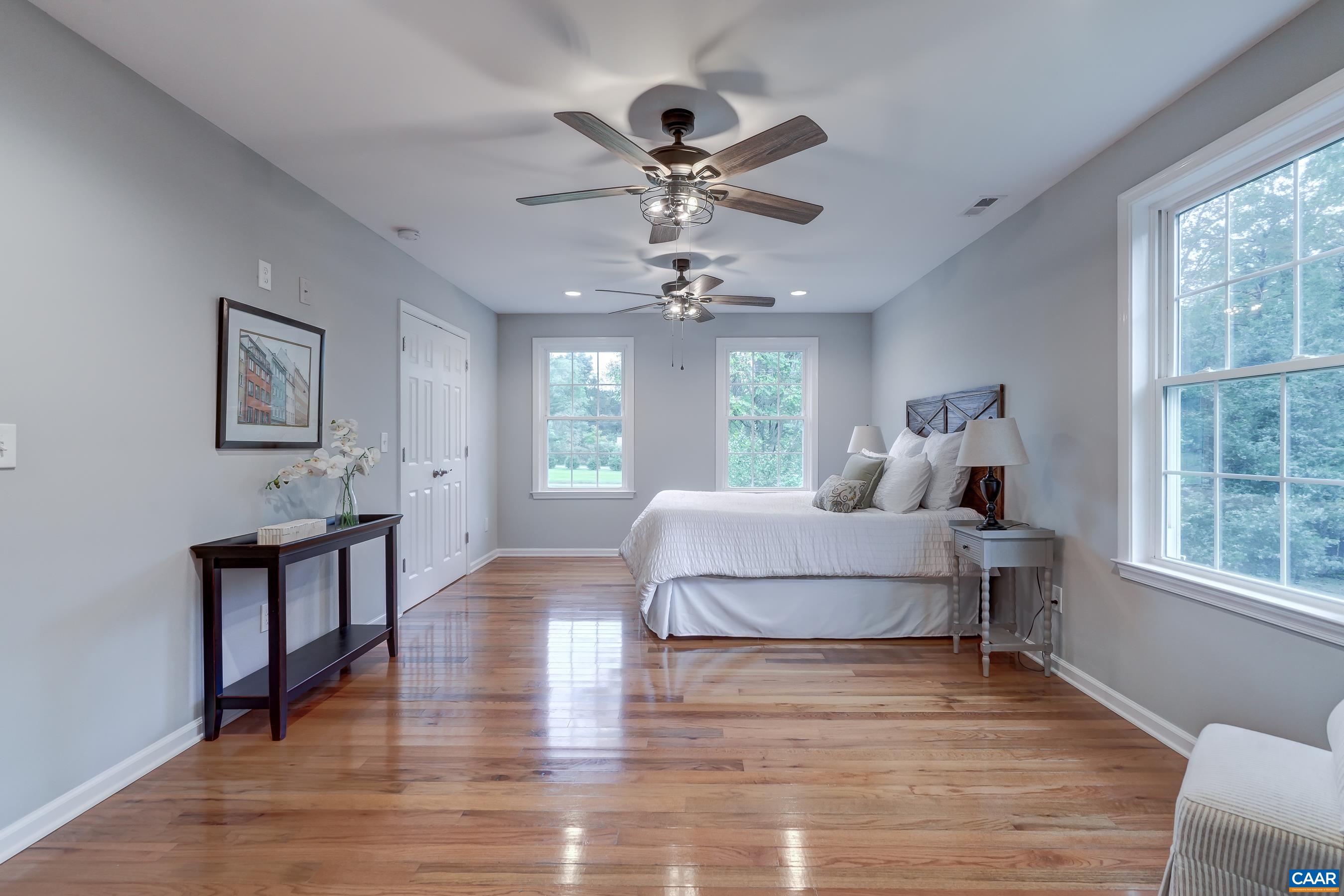 Upstairs the primary suite features a spacious walk-in closet and ensuite bathroom.