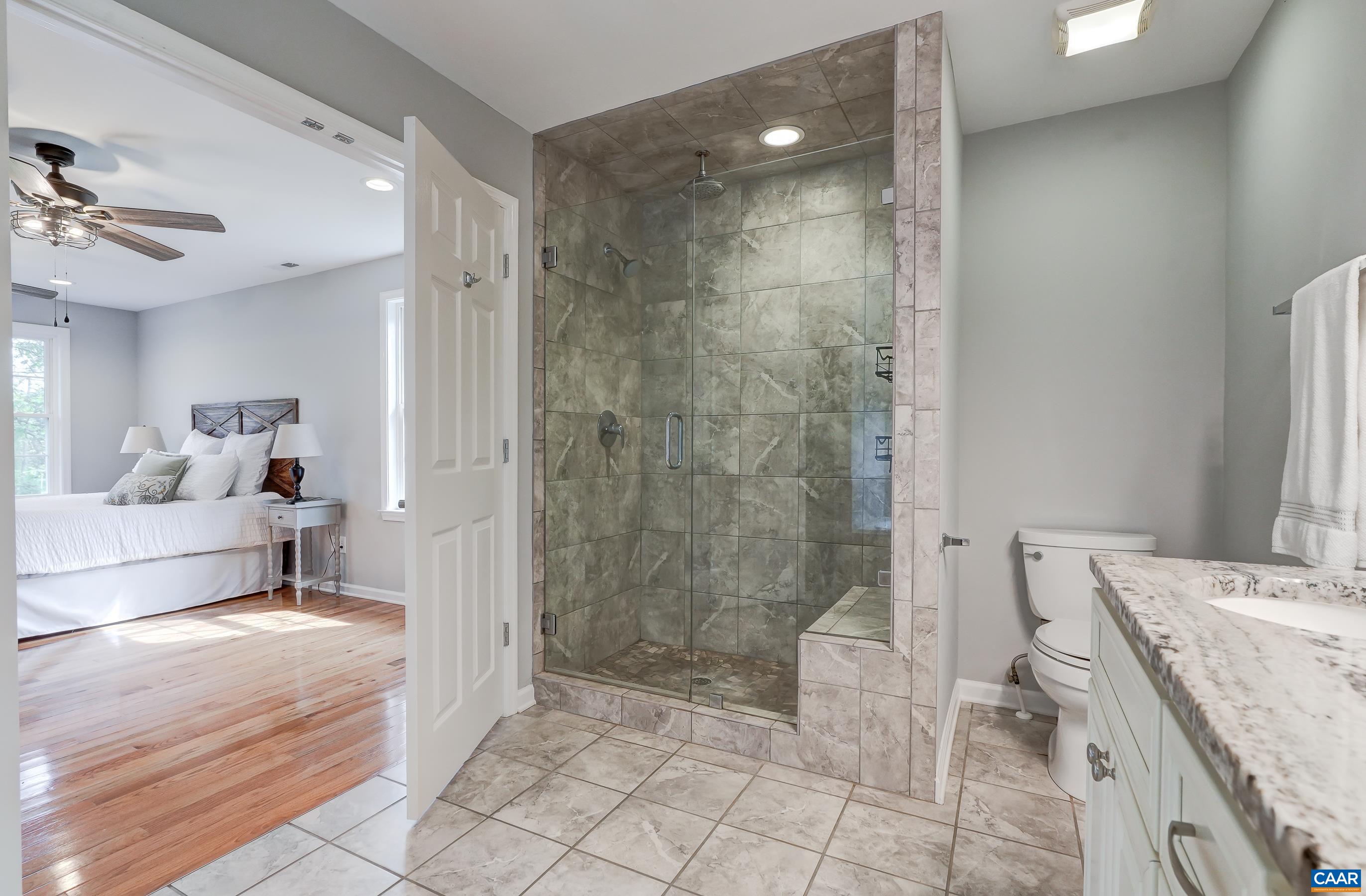 Frameless glass tiled shower.