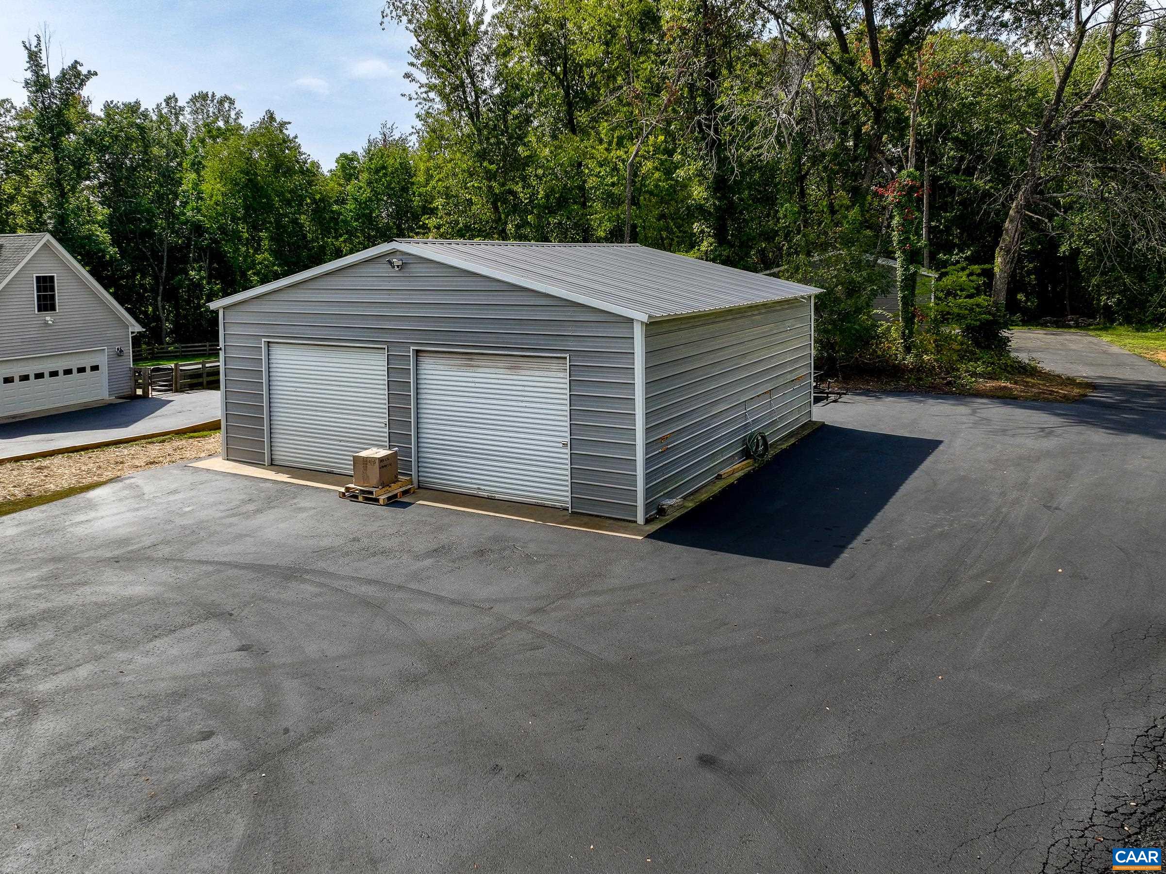 Detached 30'x30' garage with a/c and insulation could make a great workshop or additional living space.