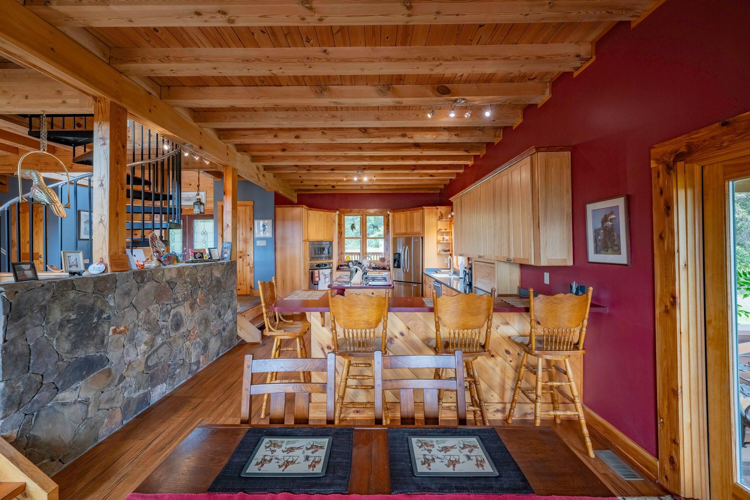 View of the kitchen/dining area. Side entrance door to your right, entry to Great Room to your left.