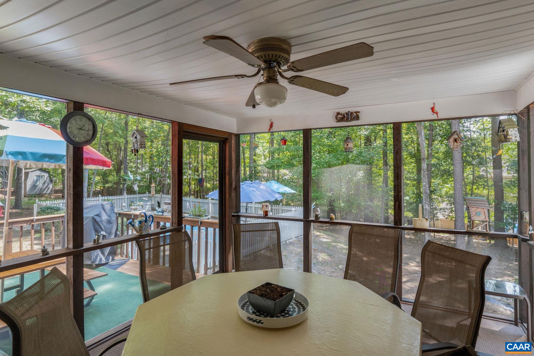 Sit in your screened porch overlooking a beautiful in ground pool