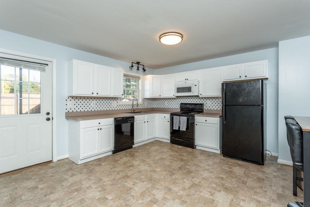 with new backsplash and painted wood cabinets!