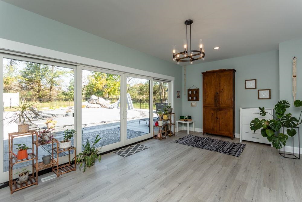 overlooking the pool and outdoor living area!