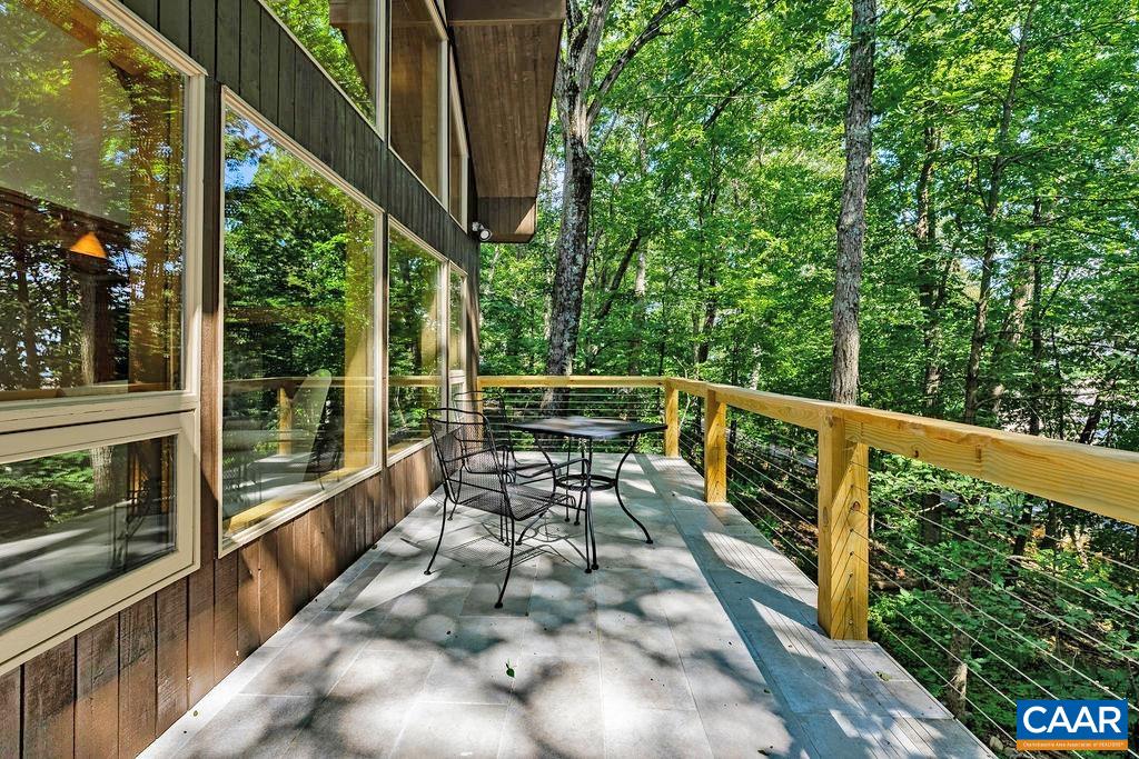 Brand new maintenance-free tile deck with stainless steel railings just finished in June of 2024.