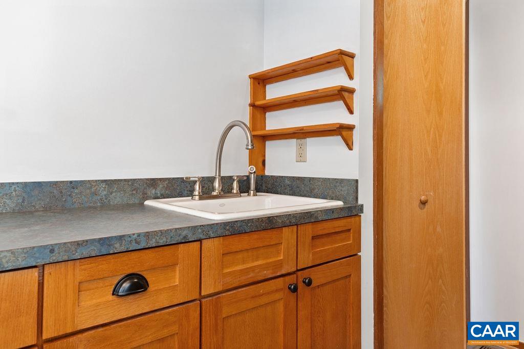 The laundry area, as well as a sink, are also in the spacious mudroom area.