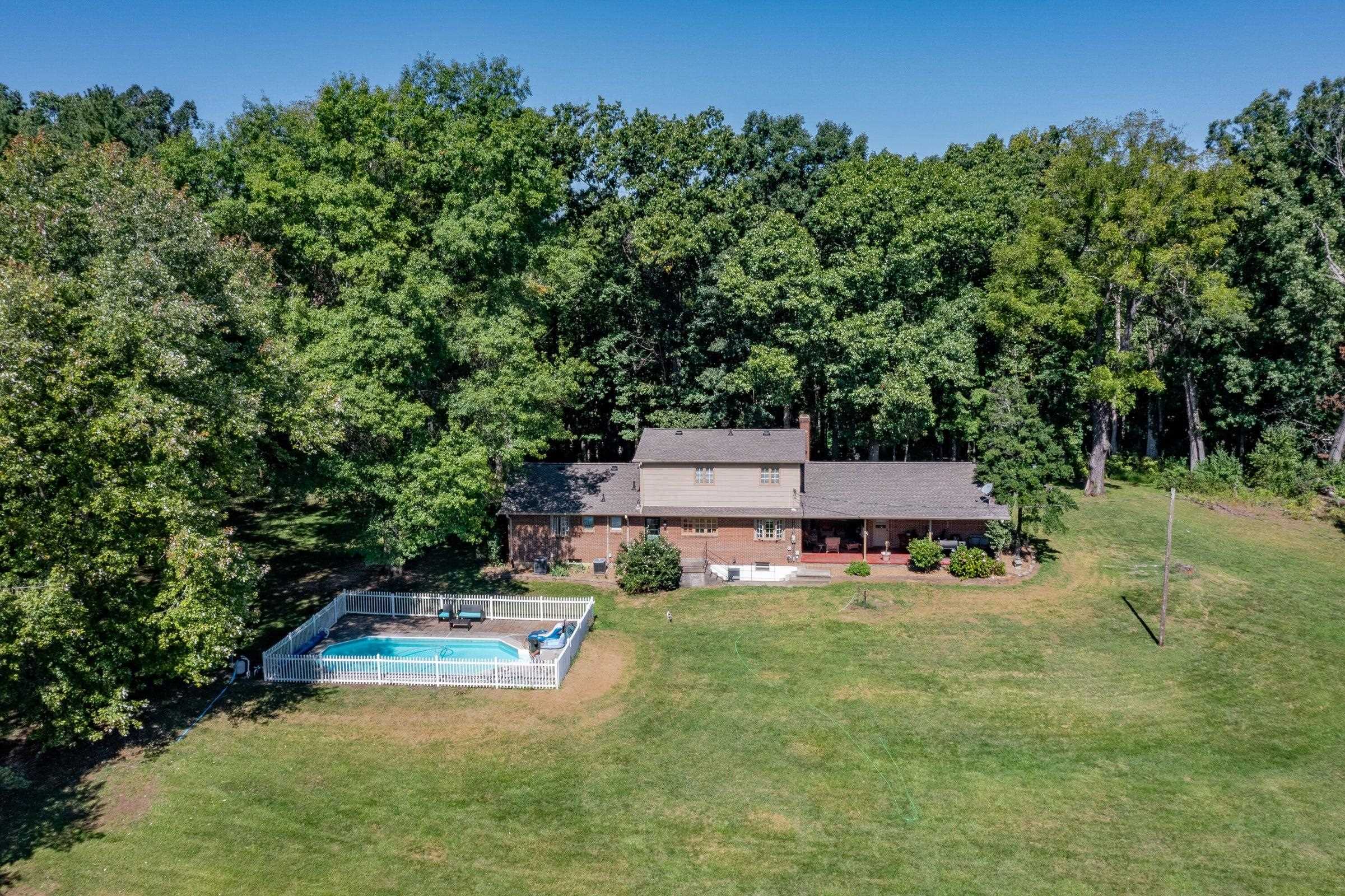 The back yard features an in-ground pool. Perfect for these hot summer days.