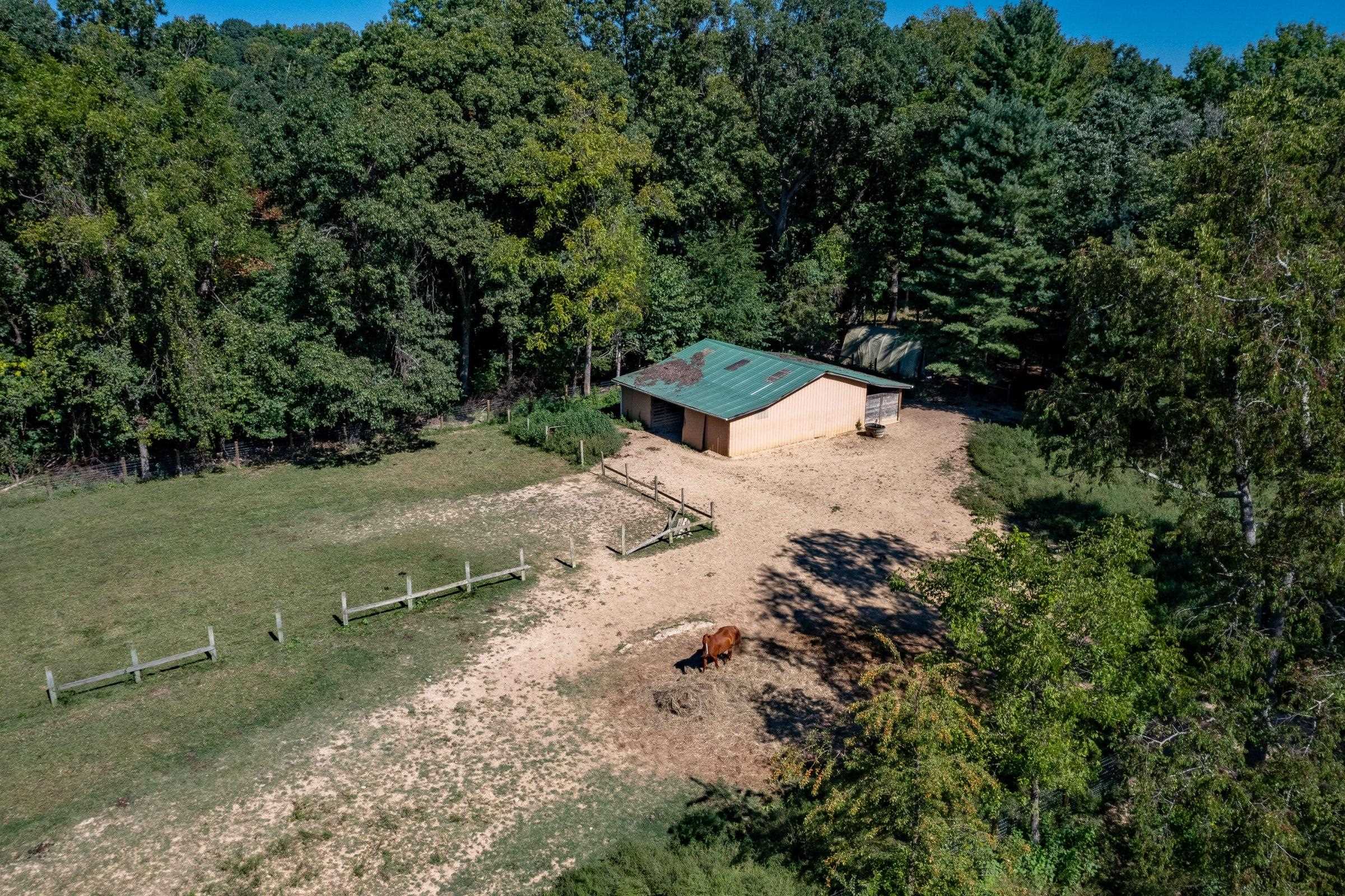 Horse barn. Riding arena to the left.