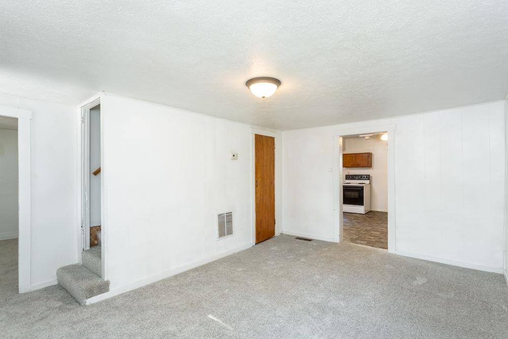 Storage under the stairs and hold the HVAC Return. Stairs to upper level.