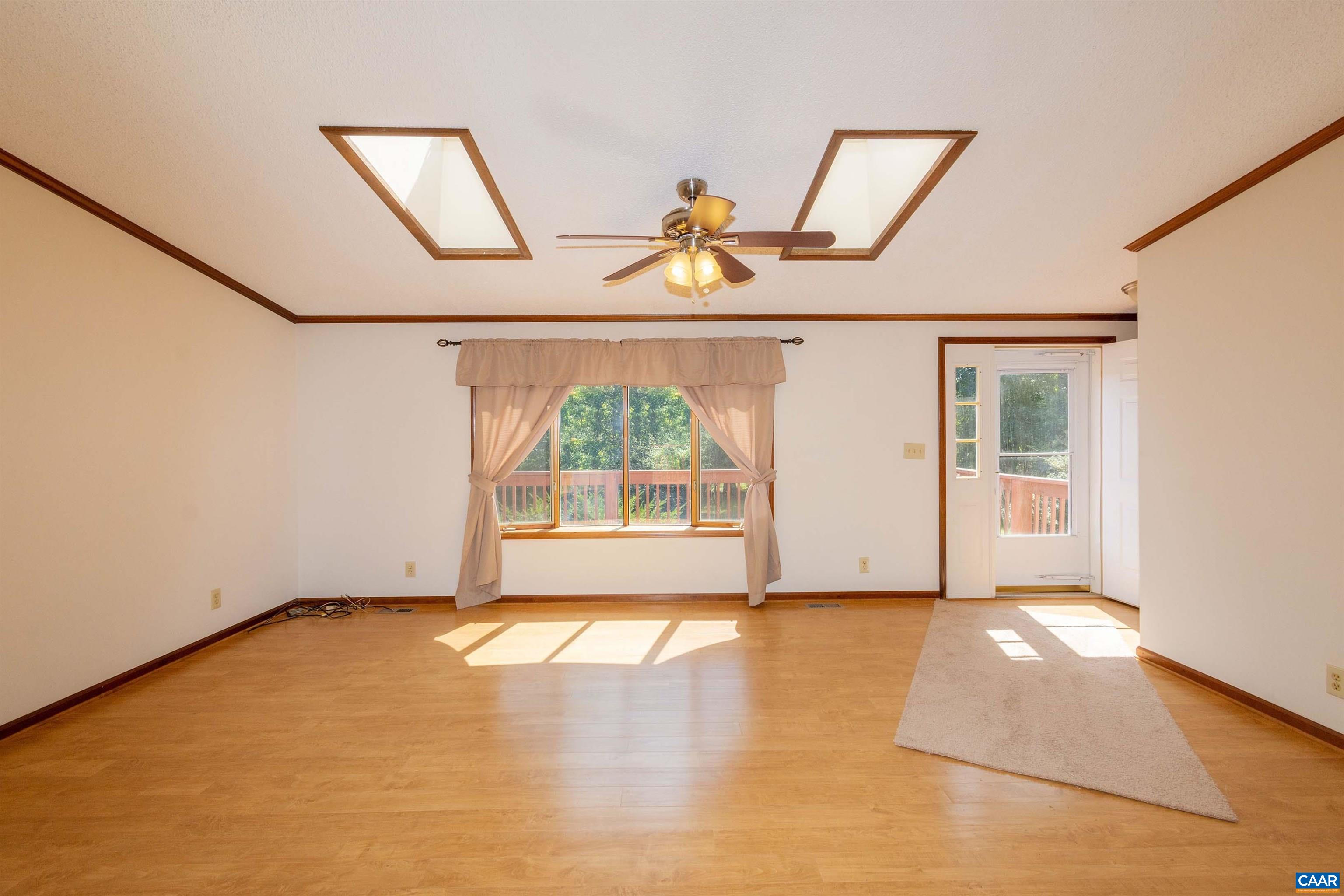 with skylights and ceiling fan.