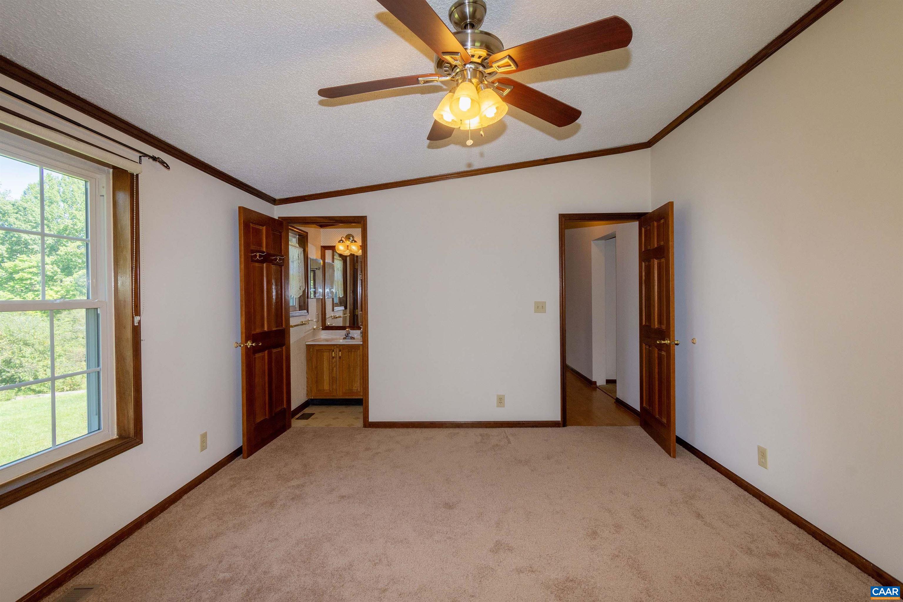 Ensuite bath on left; hallway on right.