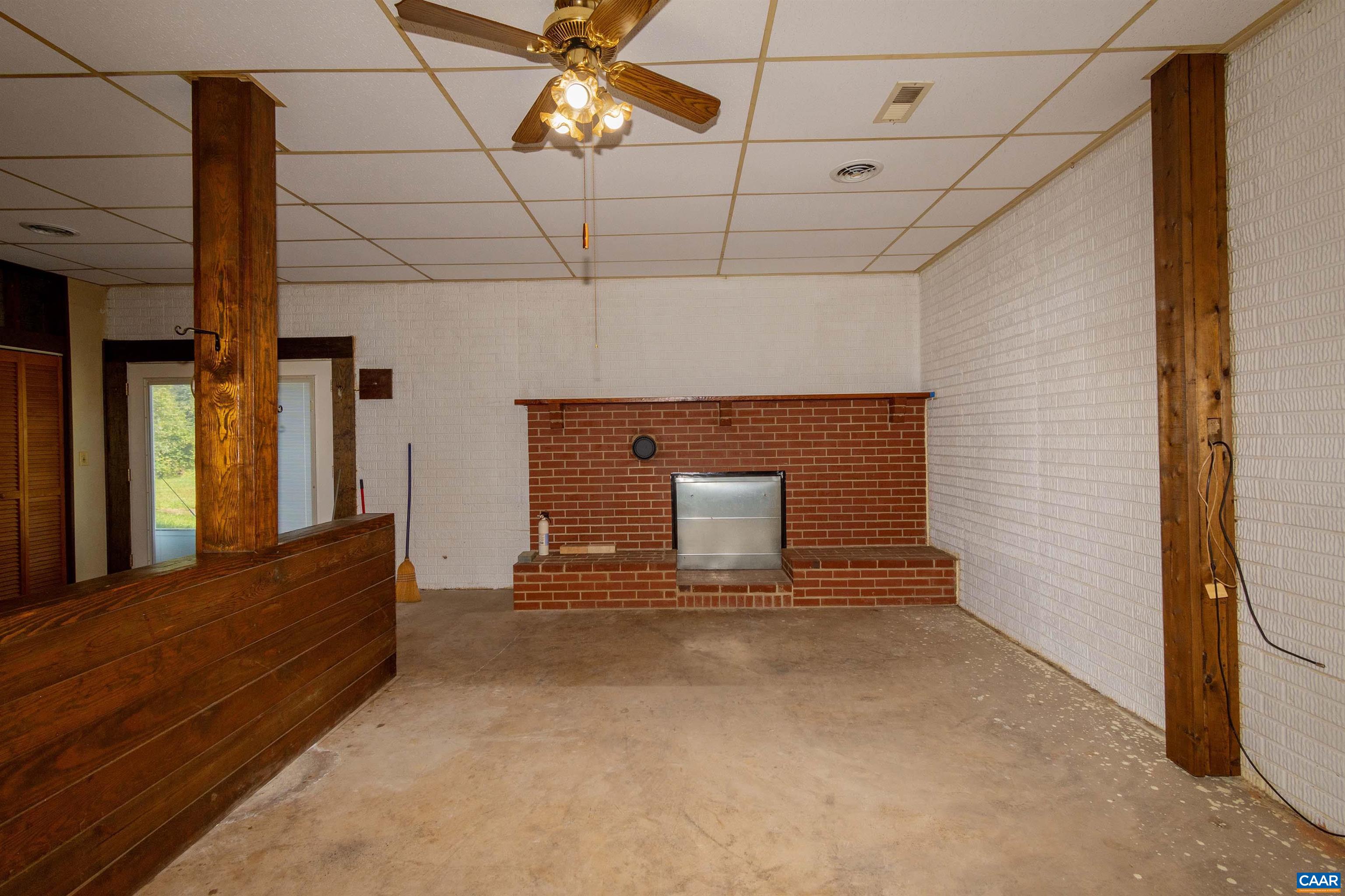 in basement, showing fireplace.