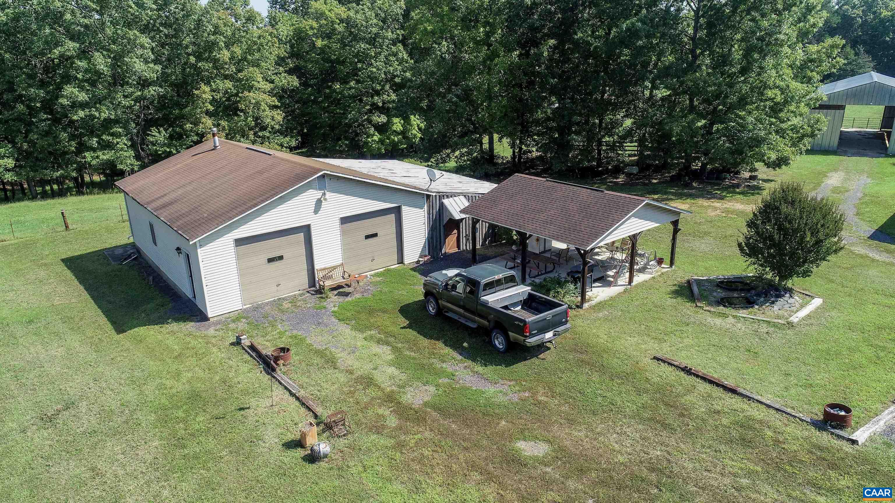 The garage measures 1280 square foot and can accommodate two, possibly three vehicles. 220VAC power with oil furnace AND woodstove for heat.