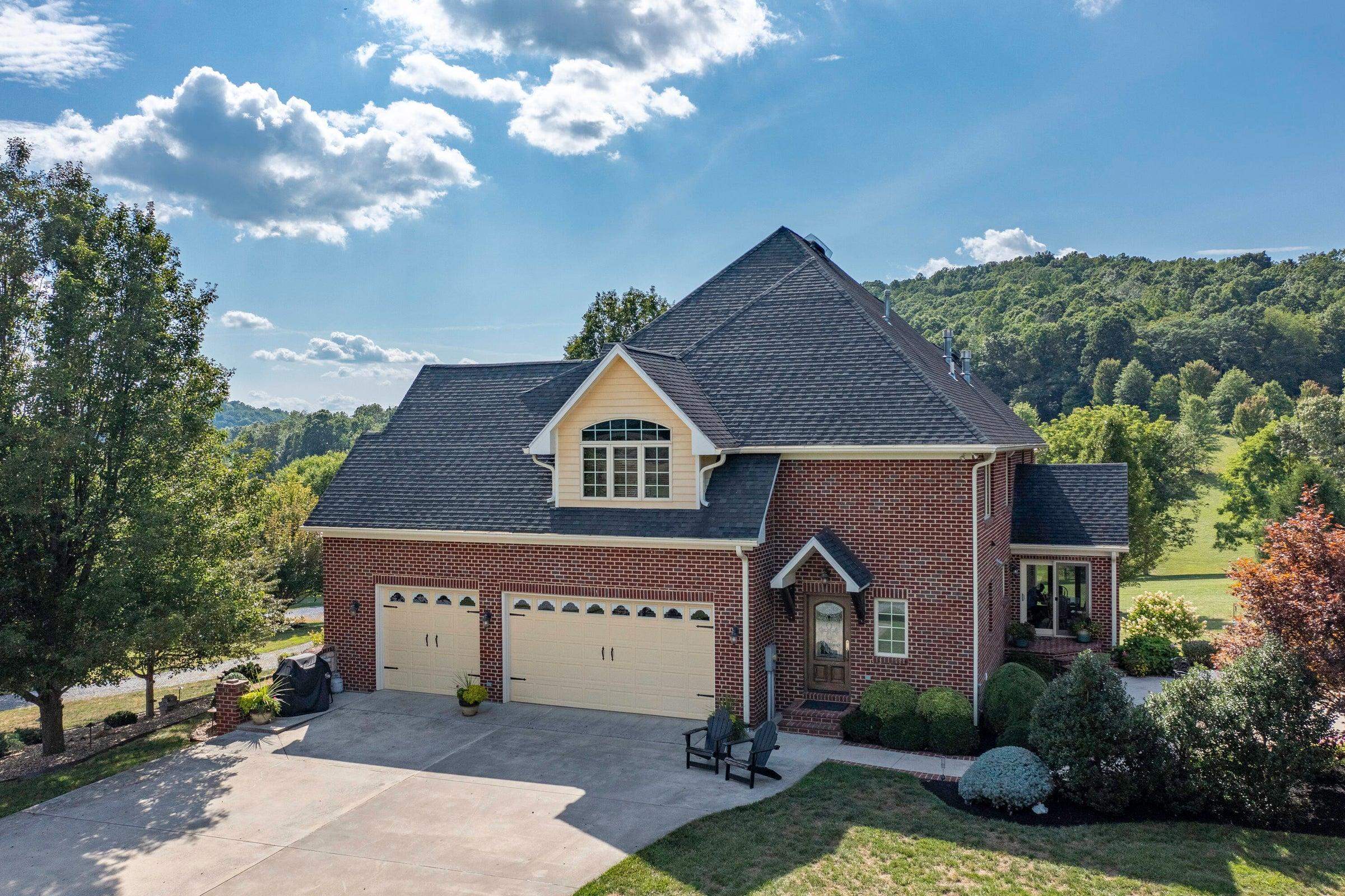 3-bay garage; cement driveway