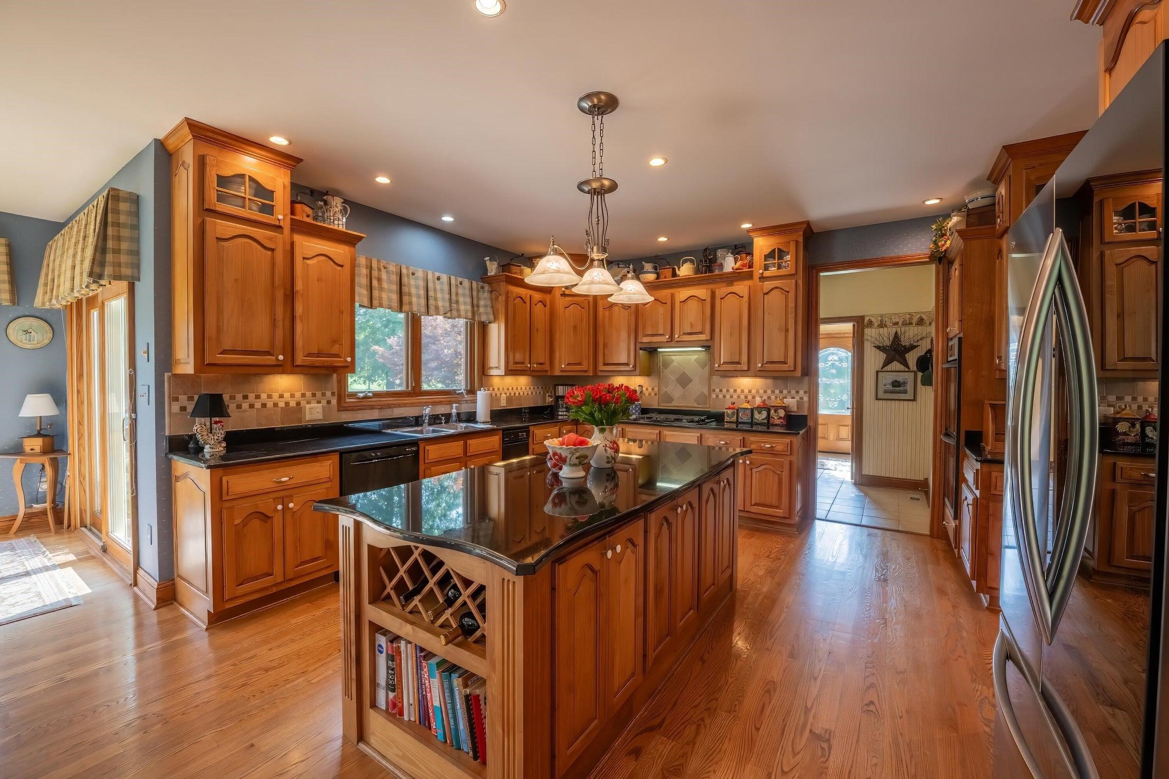 Beautiful custom-built kitchen with red birch custom cabinets.