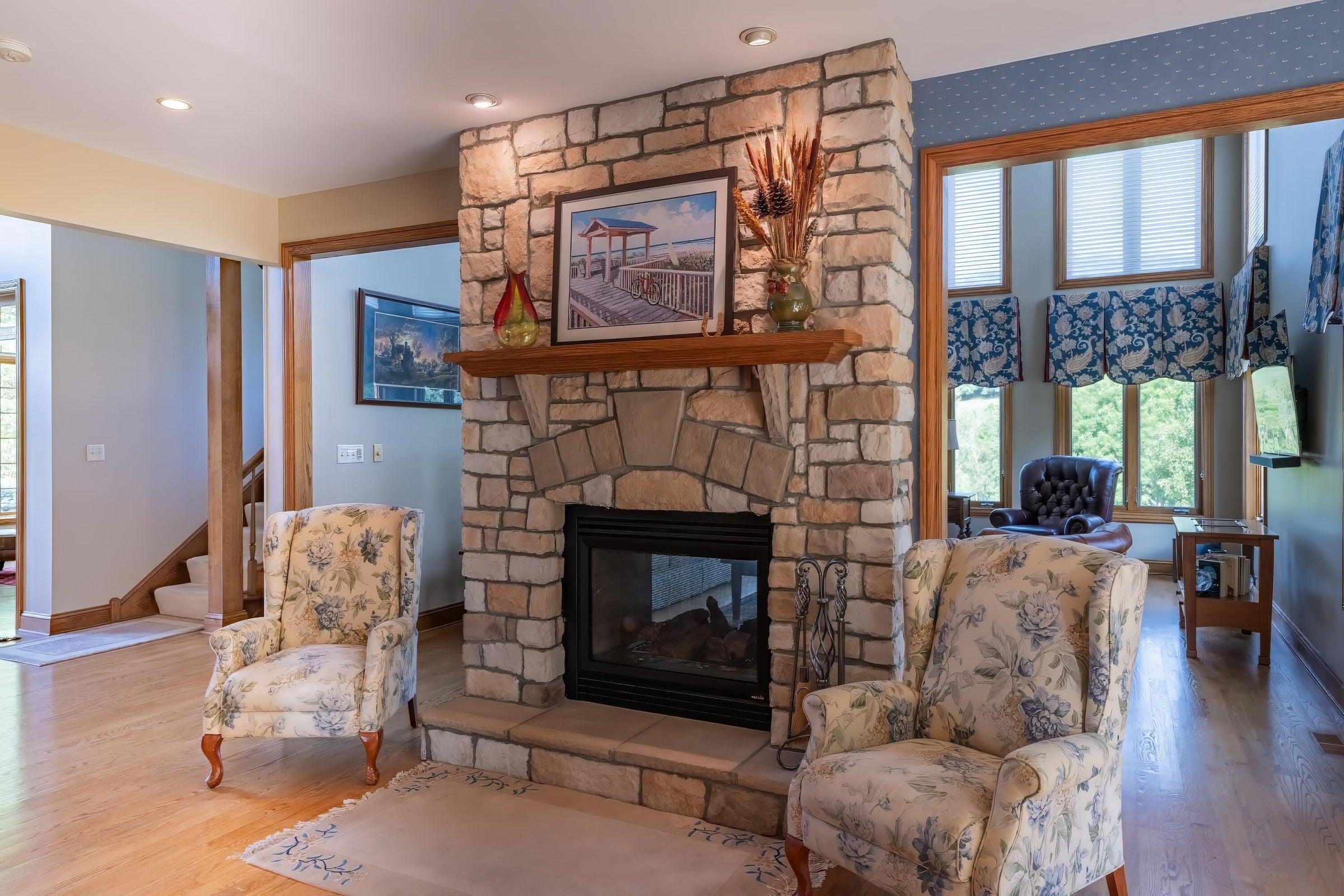 Free-standing fireplace faces both the kitchen and the Great Room. This picture shows the kitchen-facing side.