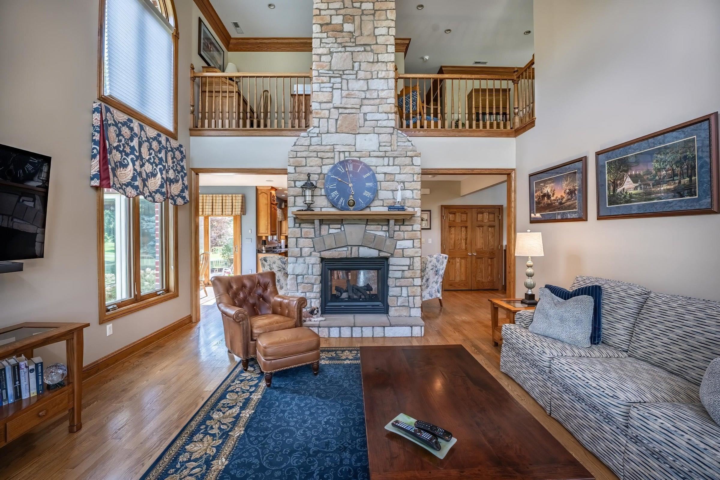 2-sided fireplace shown facing the Great Room. Also notice the loft on the Second Level.