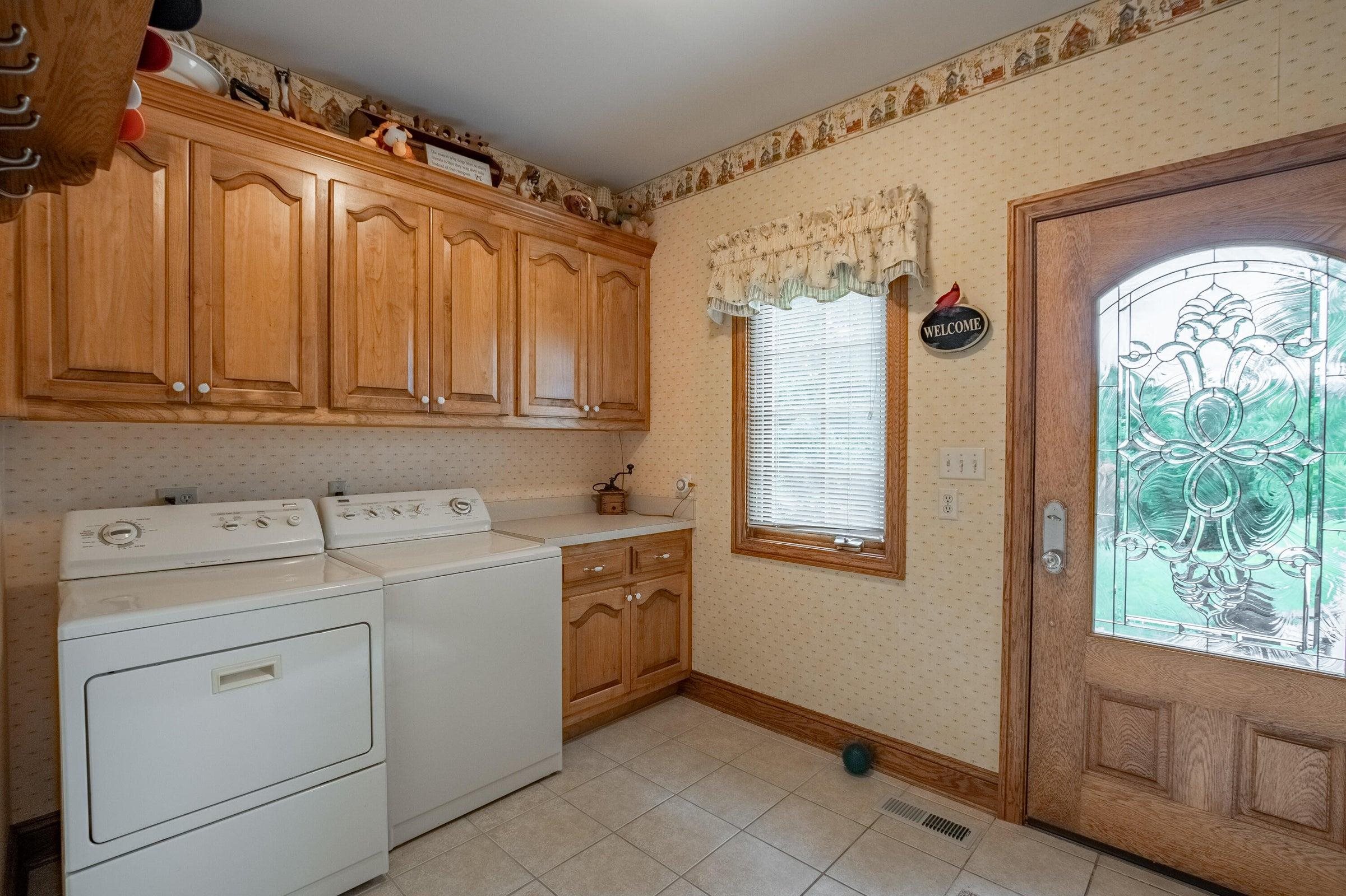 Side entrance into the spacious laundry room.