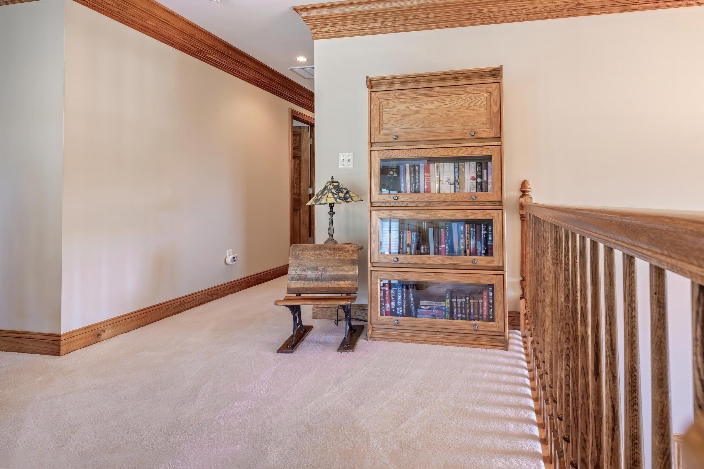 2nd story loft offers space for sitting area or den.