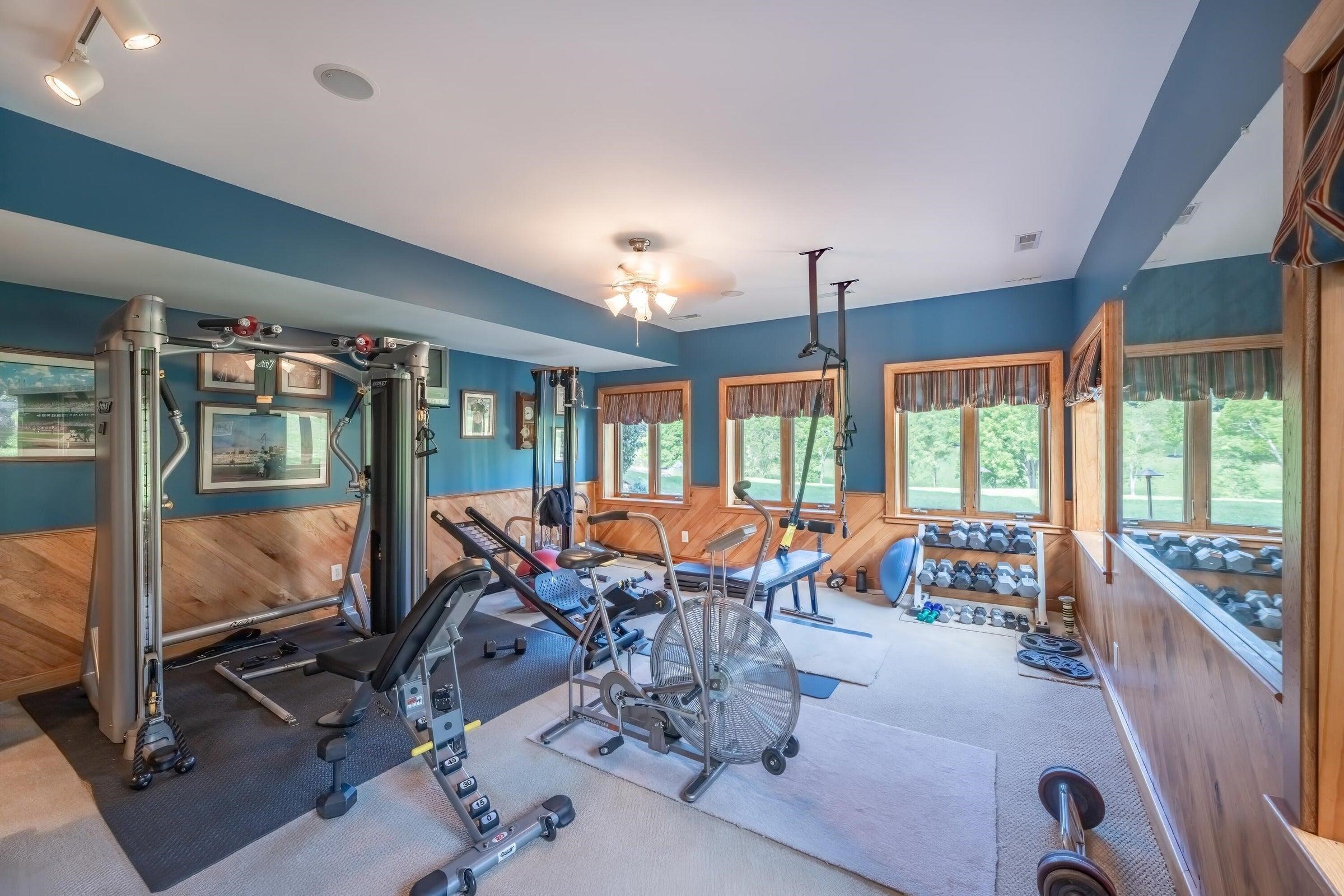 Gym  Notice the gorgeous hickory wainscotting ornamenting the walls.