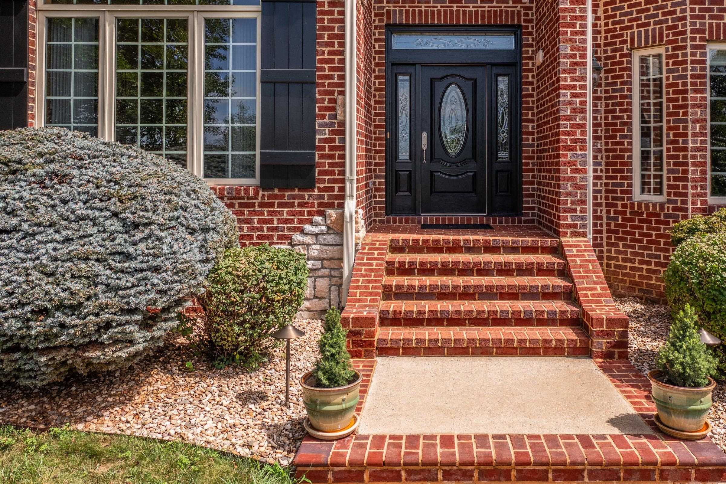 Entrance to the home . . . from a convenient circular driveway.