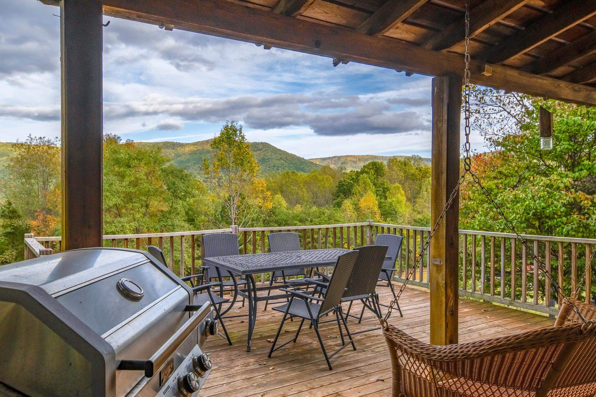 Covered porch leads to the wrap around deck.